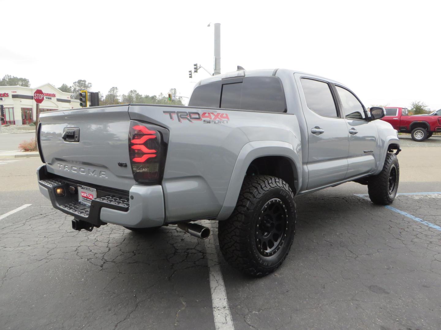 2019 grey /black Toyota Tacoma TRD Sport Double Cab (3TMCZ5AN2KM) with an 3.6L V6 DOHC 24V engine, 6A transmission, located at 2630 Grass Valley Highway, Auburn, CA, 95603, (530) 508-5100, 38.937893, -121.095482 - Must see Tacoma sitting on King 2.5 adjustable remote reservoir coilovers, King 2.5 adjustable remote reservoir rear shocks, Icon Upper control arms, BFG KO3 tires, 17" Method NV wheels, C4 front bumper, Baja Designs lights, LUXX series taillights, aluminum TRD skid plate, bedmat, bed extender, and - Photo#4
