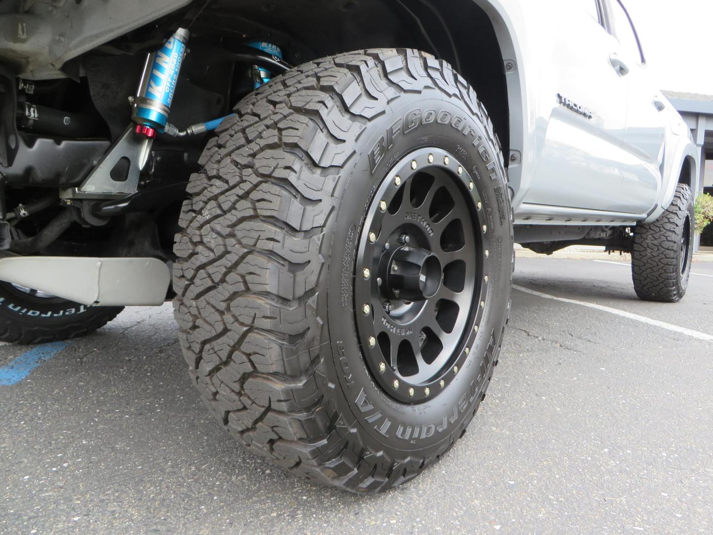 2019 grey /black Toyota Tacoma TRD Sport Double Cab (3TMCZ5AN2KM) with an 3.6L V6 DOHC 24V engine, 6A transmission, located at 2630 Grass Valley Highway, Auburn, CA, 95603, (530) 508-5100, 38.937893, -121.095482 - Must see Tacoma sitting on King 2.5 adjustable remote reservoir coilovers, King 2.5 adjustable remote reservoir rear shocks, Icon Upper control arms, BFG KO3 tires, 17" Method NV wheels, C4 front bumper, Baja Designs lights, LUXX series taillights, aluminum TRD skid plate, bedmat, bed extender, and - Photo#9