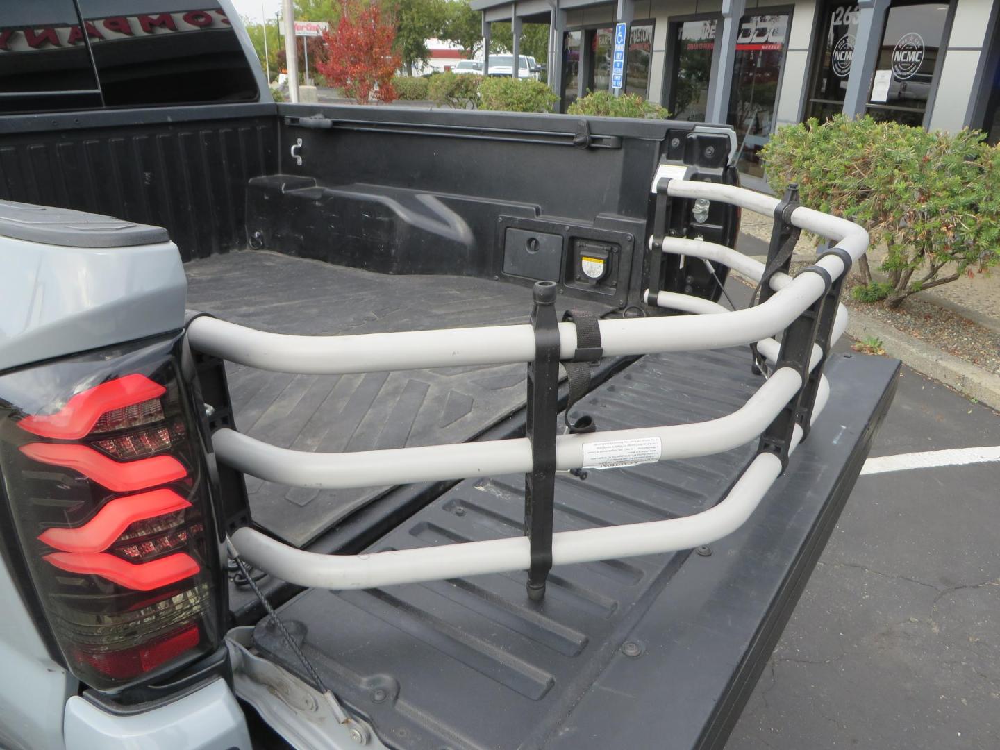 2019 grey /black Toyota Tacoma TRD Sport Double Cab (3TMCZ5AN2KM) with an 3.6L V6 DOHC 24V engine, 6A transmission, located at 2630 Grass Valley Highway, Auburn, CA, 95603, (530) 508-5100, 38.937893, -121.095482 - Must see Tacoma sitting on King 2.5 adjustable remote reservoir coilovers, King 2.5 adjustable remote reservoir rear shocks, Icon Upper control arms, BFG KO3 tires, 17" Method NV wheels, C4 front bumper, Baja Designs lights, LUXX series taillights, aluminum TRD skid plate, bedmat, bed extender, and - Photo#20