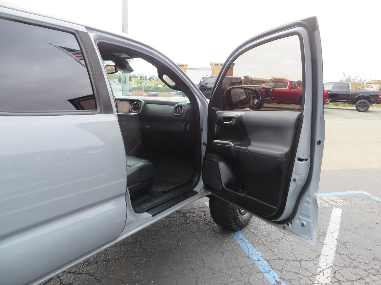 2019 grey /black Toyota Tacoma TRD Sport Double Cab (3TMCZ5AN2KM) with an 3.6L V6 DOHC 24V engine, 6A transmission, located at 2630 Grass Valley Highway, Auburn, CA, 95603, (530) 508-5100, 38.937893, -121.095482 - Must see Tacoma sitting on King 2.5 adjustable remote reservoir coilovers, King 2.5 adjustable remote reservoir rear shocks, Icon Upper control arms, BFG KO3 tires, 17" Method NV wheels, C4 front bumper, Baja Designs lights, LUXX series taillights, aluminum TRD skid plate, bedmat, bed extender, and - Photo#53