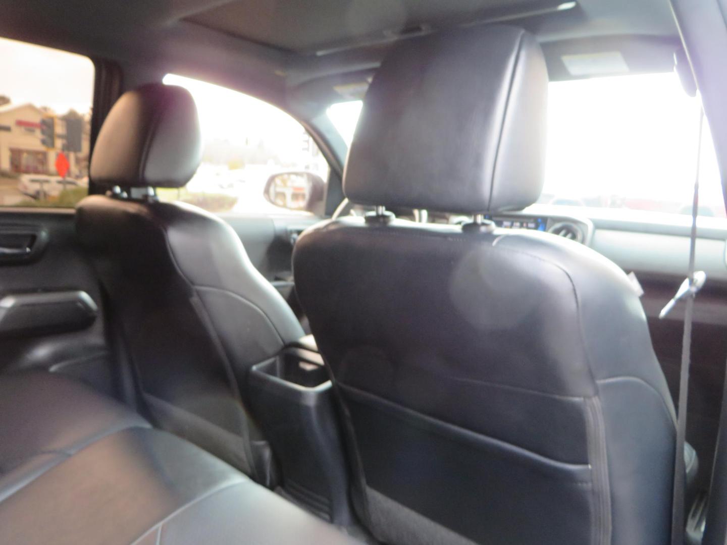 2019 grey /black Toyota Tacoma TRD Sport Double Cab (3TMCZ5AN2KM) with an 3.6L V6 DOHC 24V engine, 6A transmission, located at 2630 Grass Valley Highway, Auburn, CA, 95603, (530) 508-5100, 38.937893, -121.095482 - Must see Tacoma sitting on King 2.5 adjustable remote reservoir coilovers, King 2.5 adjustable remote reservoir rear shocks, Icon Upper control arms, BFG KO3 tires, 17" Method NV wheels, C4 front bumper, Baja Designs lights, LUXX series taillights, aluminum TRD skid plate, bedmat, bed extender, and - Photo#66