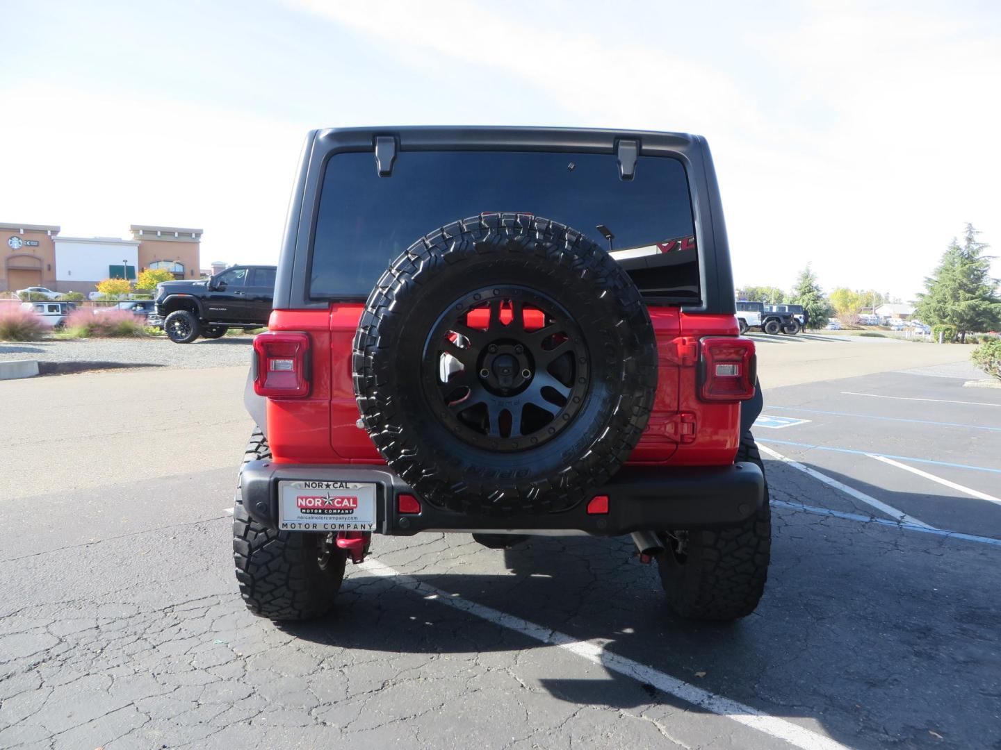 2020 Red /BLACK Jeep Wrangler Unlimited Rubicon (1C4HJXFN8LW) with an 2.0L L4 DOHC 16V TURBO engine, 6A transmission, located at 2630 Grass Valley Highway, Auburn, CA, 95603, (530) 508-5100, 38.937893, -121.095482 - Features - 17'' Fuel Recoil wheels, 35'' Nitto Ridge Grappler tires, Smittybilt XRC Flat fenders, Smittybilt inner fender liners, and new Alea Leather. - Photo#3