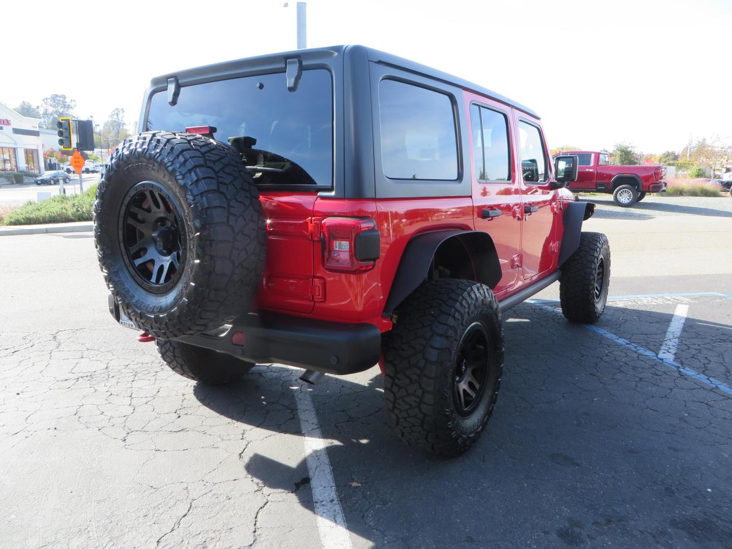 2020 Red /BLACK Jeep Wrangler Unlimited Rubicon (1C4HJXFN8LW) with an 2.0L L4 DOHC 16V TURBO engine, 6A transmission, located at 2630 Grass Valley Highway, Auburn, CA, 95603, (530) 508-5100, 38.937893, -121.095482 - Features - 17'' Fuel Recoil wheels, 35'' Nitto Ridge Grappler tires, Smittybilt XRC Flat fenders, Smittybilt inner fender liners, and new Alea Leather. - Photo#4