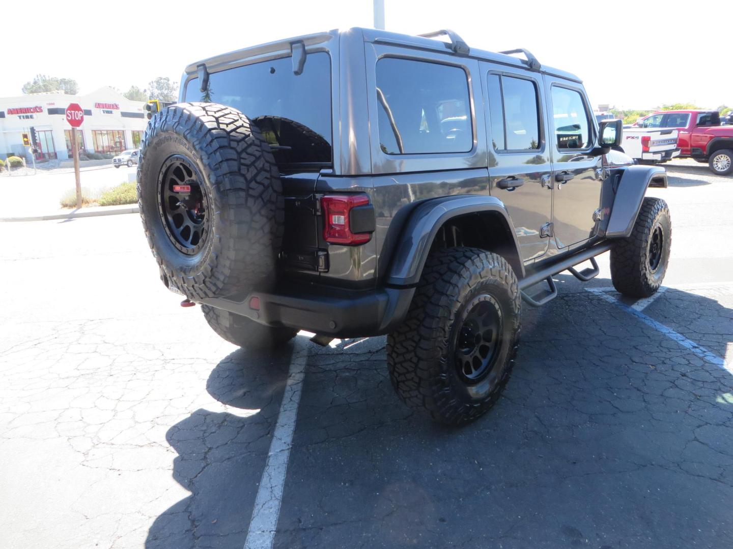 2020 Gray Jeep Wrangler Unlimited Rubicon (1C4HJXFN0LW) with an 2.0L L4 DOHC 16V TURBO engine, 6A transmission, located at 2630 Grass Valley Highway, Auburn, CA, 95603, (530) 508-5100, 38.937893, -121.095482 - Features a 3" Zone offroad suspension system, Fox Adventure series shocks, 37" Toyo RT tires, 17" Double Black Method NV wheels, Teraflex HD spare tire carrier, Nerf steps, and roof rack crossbars. - Photo#4