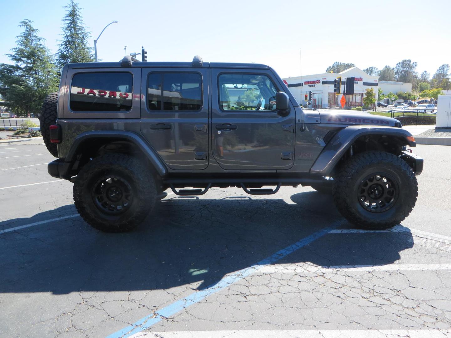 2020 Gray Jeep Wrangler Unlimited Rubicon (1C4HJXFN0LW) with an 2.0L L4 DOHC 16V TURBO engine, 6A transmission, located at 2630 Grass Valley Highway, Auburn, CA, 95603, (530) 508-5100, 38.937893, -121.095482 - Features a 3" Zone offroad suspension system, Fox Adventure series shocks, 37" Toyo RT tires, 17" Double Black Method NV wheels, Teraflex HD spare tire carrier, Nerf steps, and roof rack crossbars. - Photo#5