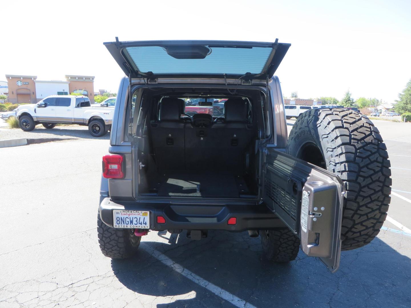 2020 Gray Jeep Wrangler Unlimited Rubicon (1C4HJXFN0LW) with an 2.0L L4 DOHC 16V TURBO engine, 6A transmission, located at 2630 Grass Valley Highway, Auburn, CA, 95603, (530) 508-5100, 38.937893, -121.095482 - Features a 3" Zone offroad suspension system, Fox Adventure series shocks, 37" Toyo RT tires, 17" Double Black Method NV wheels, Teraflex HD spare tire carrier, Nerf steps, and roof rack crossbars. - Photo#65