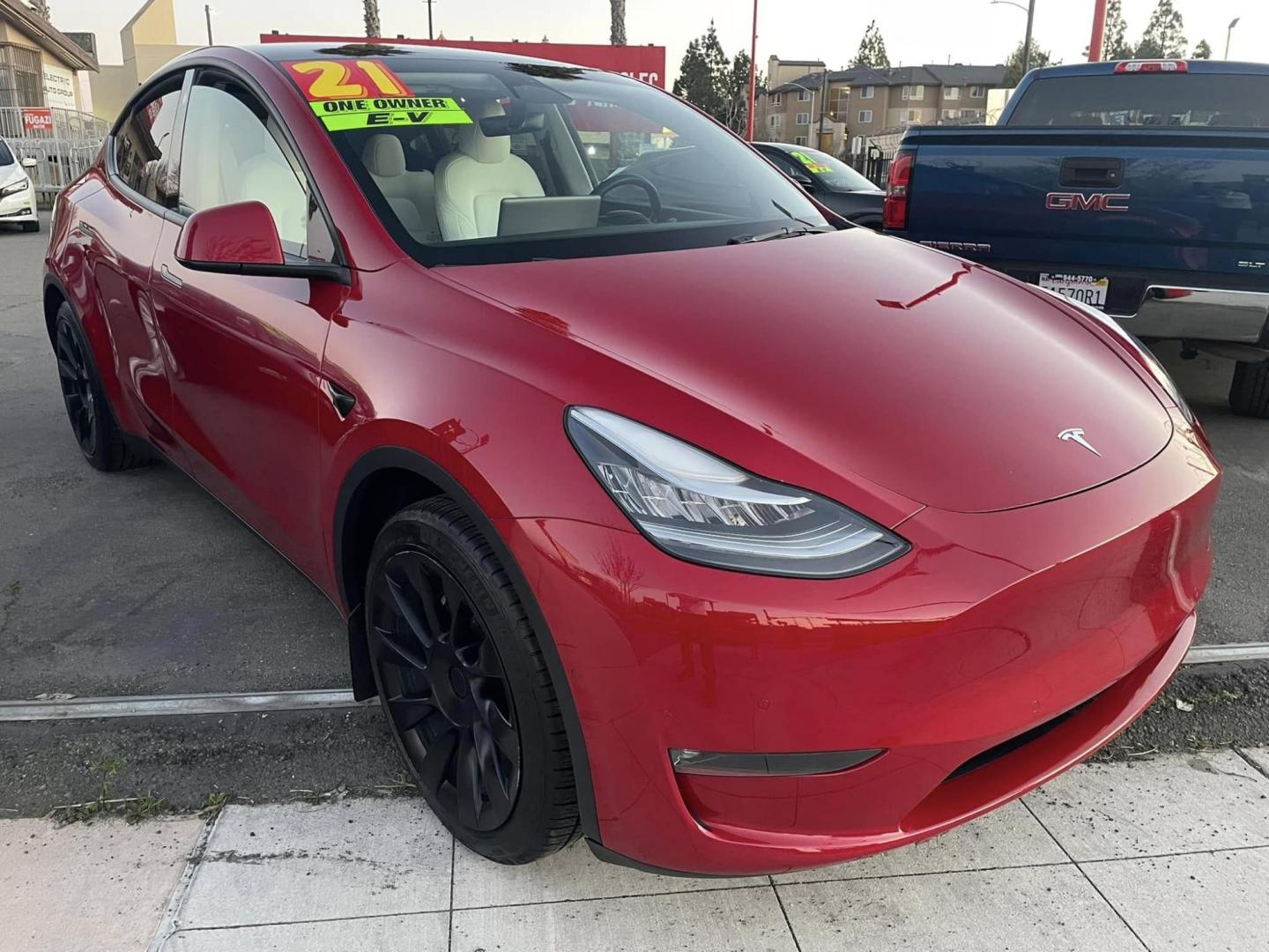 2021 RED /WHITE Tesla Model Y Long Range (5YJYGDEE9MF) with an ELECTRIC engine, 1A transmission, located at 744 E Miner Ave, Stockton, CA, 95202, (209) 944-5770, 37.956863, -121.282082 - PLUS TAXES AND FEES NO CHARGER AVAILABLE - Photo#0