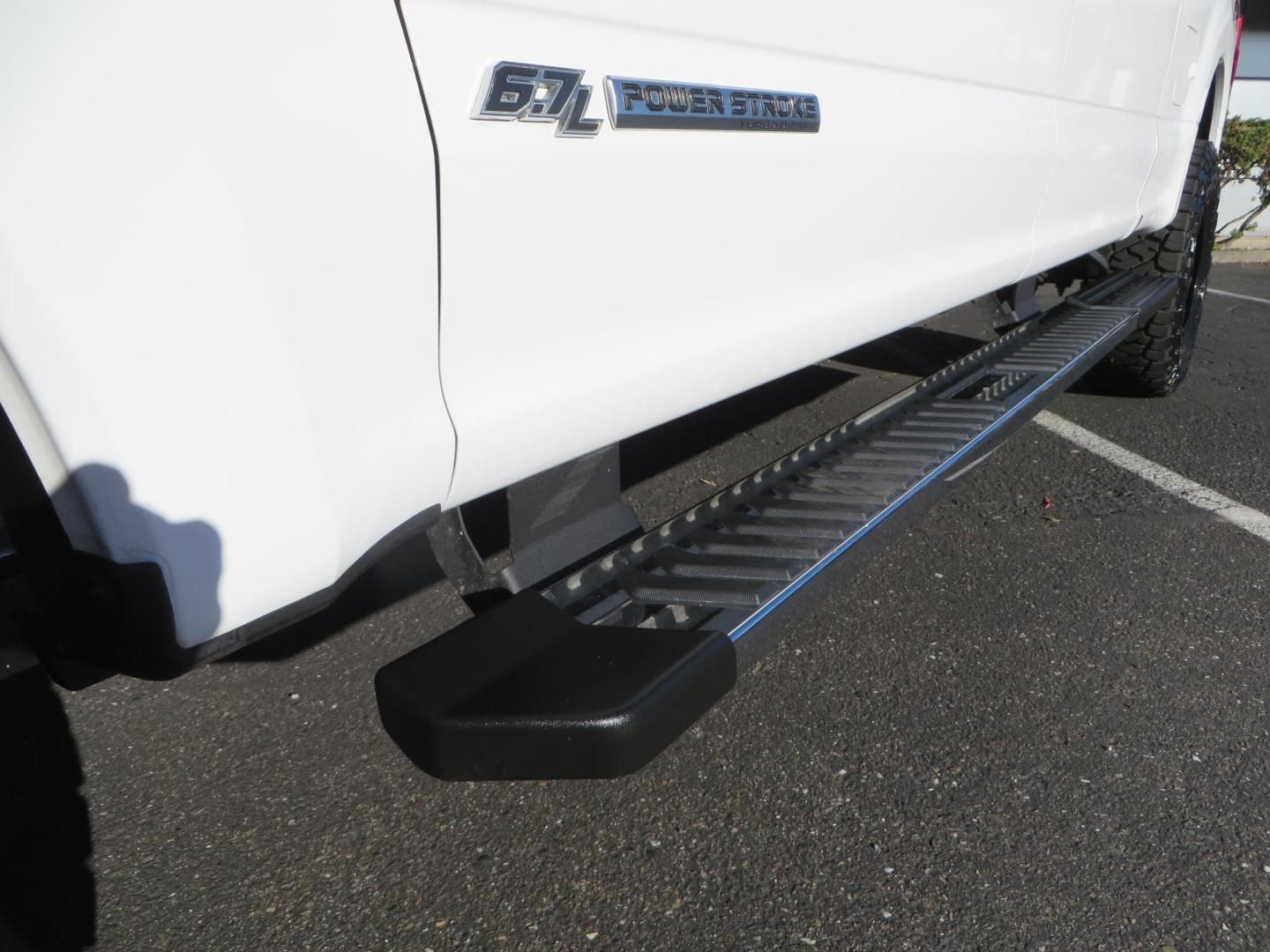 2021 White /BLACK Ford F-250 SD Lariat Crew Cab 4WD (1FT7W2BTXME) with an 6.7L V8 OHV 16V DIESEL engine, 6A transmission, located at 2630 Grass Valley Highway, Auburn, CA, 95603, (530) 508-5100, 38.937893, -121.095482 - Features a BDS level kit with Fox 2.0 shocks, 35" Toyo Open Country RT trail tires, 18" KMC IMS wheels, Weathertech Bug deflector and floor liners. - Photo#11