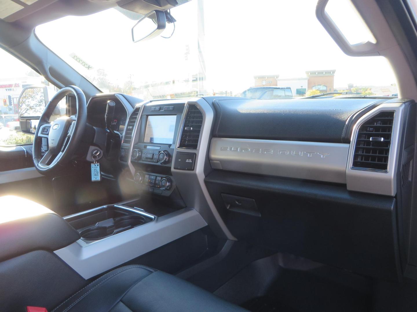 2021 White /BLACK Ford F-250 SD Lariat Crew Cab 4WD (1FT7W2BTXME) with an 6.7L V8 OHV 16V DIESEL engine, 6A transmission, located at 2630 Grass Valley Highway, Auburn, CA, 95603, (530) 508-5100, 38.937893, -121.095482 - Features a BDS level kit with Fox 2.0 shocks, 35" Toyo Open Country RT trail tires, 18" KMC IMS wheels, Weathertech Bug deflector and floor liners. - Photo#56