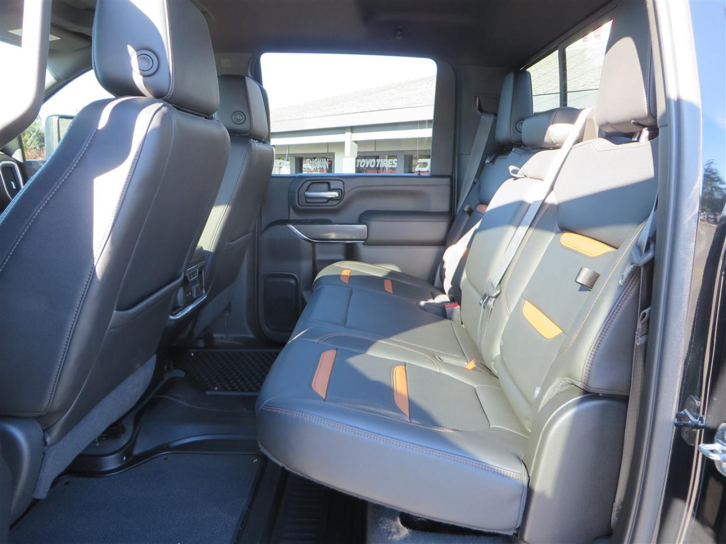 2021 BLACK /BLACK GMC Sierra 2500HD AT4 Crew Cab 4WD (1GT49PEY3MF) with an 6.6L V8 OHV 16 DIESEL engine, 6A transmission, located at 2630 Grass Valley Highway, Auburn, CA, 95603, (530) 508-5100, 38.937893, -121.095482 - Features a RC 7'' suspension system, 37'' Nitto Ridge Grappler tires, 22'' 4 Play wheels, Airlift helper bags with compressor, soft folding tonneau cover, and window tint. - Photo#49