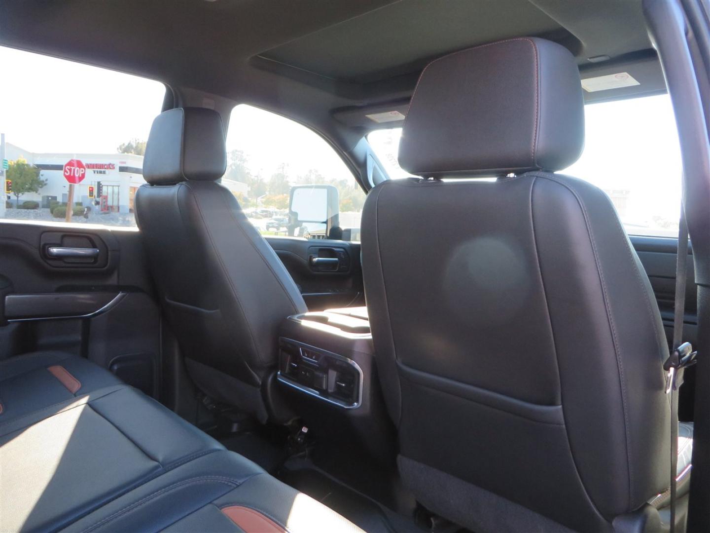 2021 BLACK /BLACK GMC Sierra 2500HD AT4 Crew Cab 4WD (1GT49PEY3MF) with an 6.6L V8 OHV 16 DIESEL engine, 6A transmission, located at 2630 Grass Valley Highway, Auburn, CA, 95603, (530) 508-5100, 38.937893, -121.095482 - Features a RC 7'' suspension system, 37'' Nitto Ridge Grappler tires, 22'' 4 Play wheels, Airlift helper bags with compressor, soft folding tonneau cover, and window tint. - Photo#67