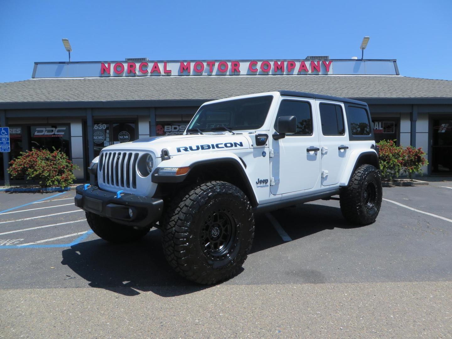 2021 White /Black Jeep Wrangler Unlimited Rubicon 4XE (1C4JJXR64MW) with an 2.0L L4 DOHC 16V HYBRID engine, 8A transmission, located at 2630 Grass Valley Highway, Auburn, CA, 95603, (530) 508-5100, 38.937893, -121.095482 - Mopar lifted JL with 17" Black Rhino Kelso wheels, 37" Toyo RT Trail tires, and a Teraflex HD tire relocation. - Photo#0