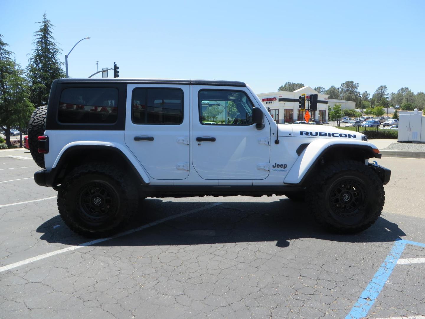 2021 White /Black Jeep Wrangler Unlimited Rubicon 4XE (1C4JJXR64MW) with an 2.0L L4 DOHC 16V HYBRID engine, 8A transmission, located at 2630 Grass Valley Highway, Auburn, CA, 95603, (530) 508-5100, 38.937893, -121.095482 - Mopar lifted JL with 17" Black Rhino Kelso wheels, 37" Toyo RT Trail tires, and a Teraflex HD tire relocation. - Photo#3