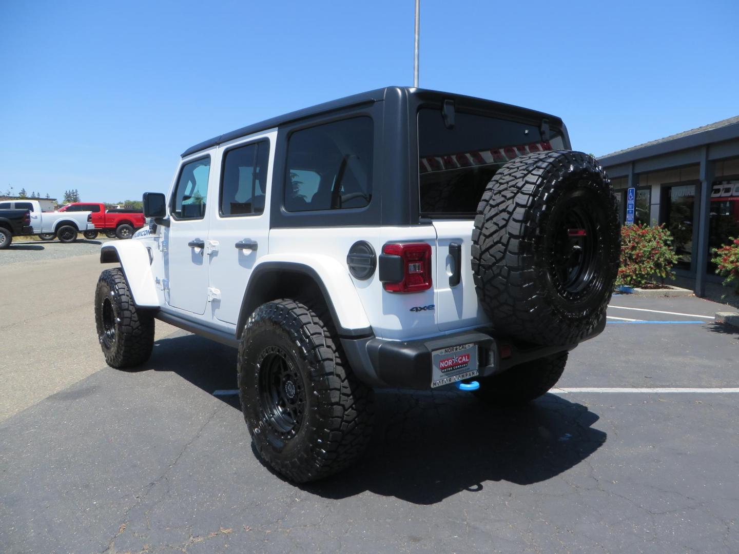 2021 White /Black Jeep Wrangler Unlimited Rubicon 4XE (1C4JJXR64MW) with an 2.0L L4 DOHC 16V HYBRID engine, 8A transmission, located at 2630 Grass Valley Highway, Auburn, CA, 95603, (530) 508-5100, 38.937893, -121.095482 - Mopar lifted JL with 17" Black Rhino Kelso wheels, 37" Toyo RT Trail tires, and a Teraflex HD tire relocation. - Photo#6