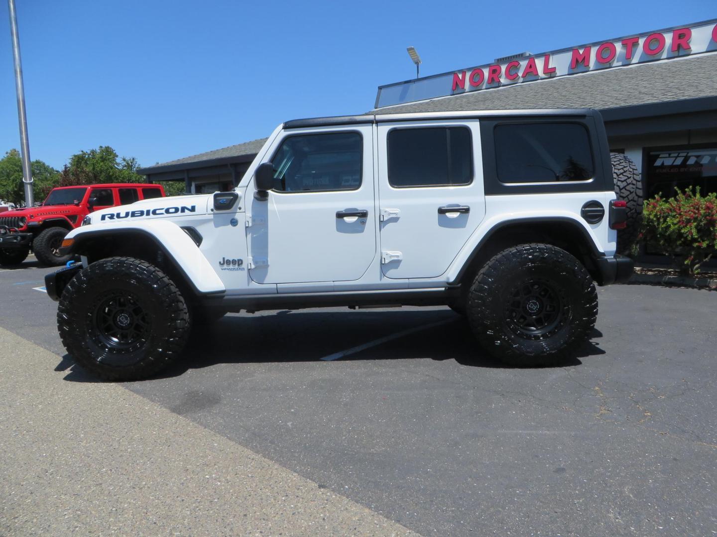 2021 White /Black Jeep Wrangler Unlimited Rubicon 4XE (1C4JJXR64MW) with an 2.0L L4 DOHC 16V HYBRID engine, 8A transmission, located at 2630 Grass Valley Highway, Auburn, CA, 95603, (530) 508-5100, 38.937893, -121.095482 - Mopar lifted JL with 17" Black Rhino Kelso wheels, 37" Toyo RT Trail tires, and a Teraflex HD tire relocation. - Photo#7
