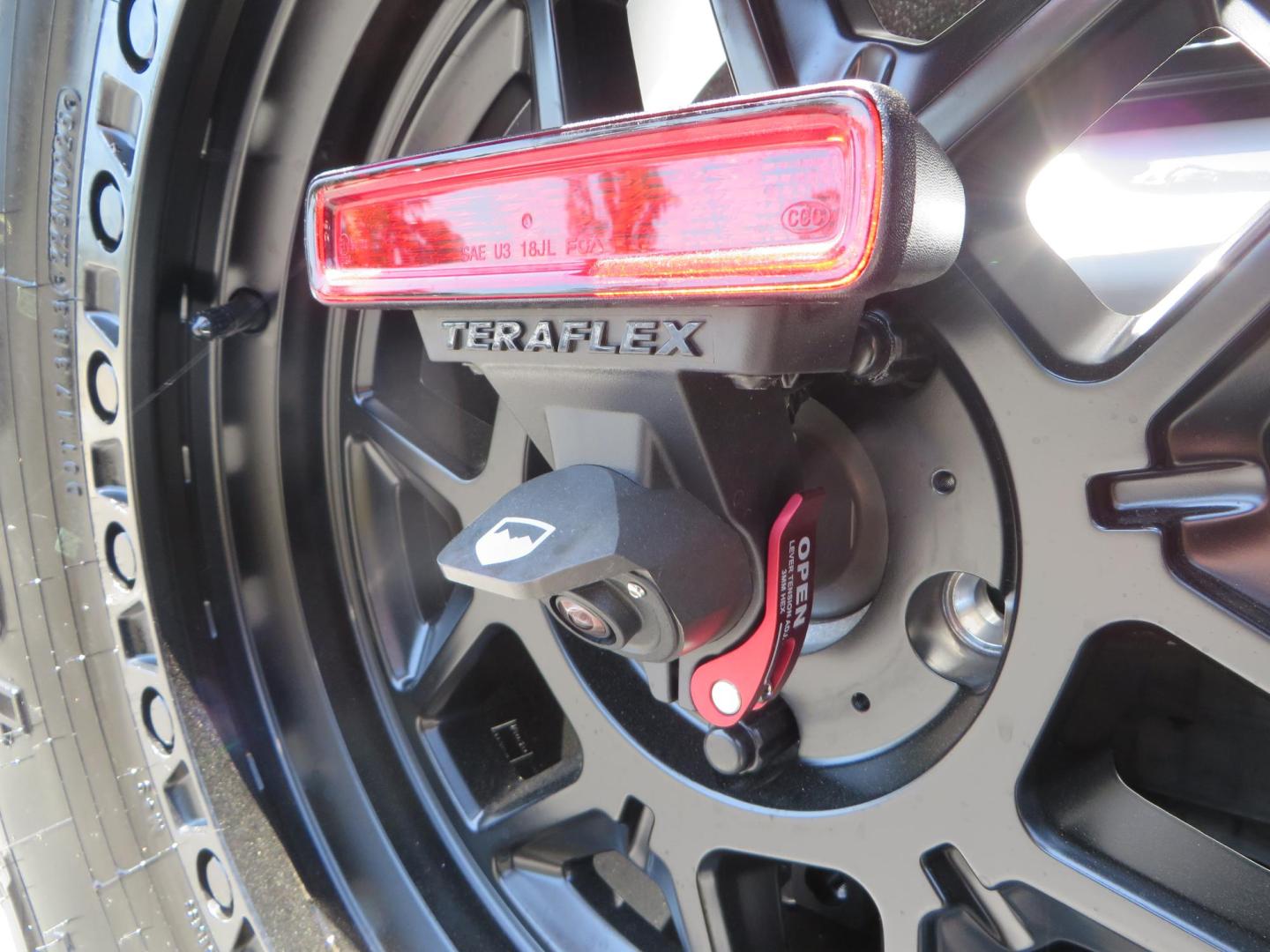 2021 White /Black Jeep Wrangler Unlimited Rubicon 4XE (1C4JJXR64MW) with an 2.0L L4 DOHC 16V HYBRID engine, 8A transmission, located at 2630 Grass Valley Highway, Auburn, CA, 95603, (530) 508-5100, 38.937893, -121.095482 - Mopar lifted JL with 17" Black Rhino Kelso wheels, 37" Toyo RT Trail tires, and a Teraflex HD tire relocation. - Photo#16