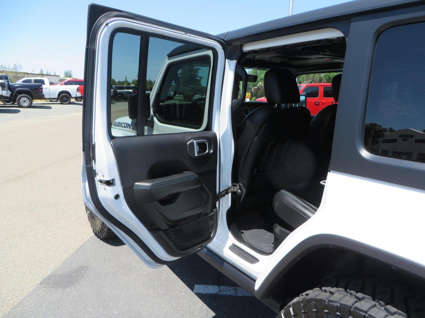 2021 White /Black Jeep Wrangler Unlimited Rubicon 4XE (1C4JJXR64MW) with an 2.0L L4 DOHC 16V HYBRID engine, 8A transmission, located at 2630 Grass Valley Highway, Auburn, CA, 95603, (530) 508-5100, 38.937893, -121.095482 - Mopar lifted JL with 17" Black Rhino Kelso wheels, 37" Toyo RT Trail tires, and a Teraflex HD tire relocation. - Photo#43