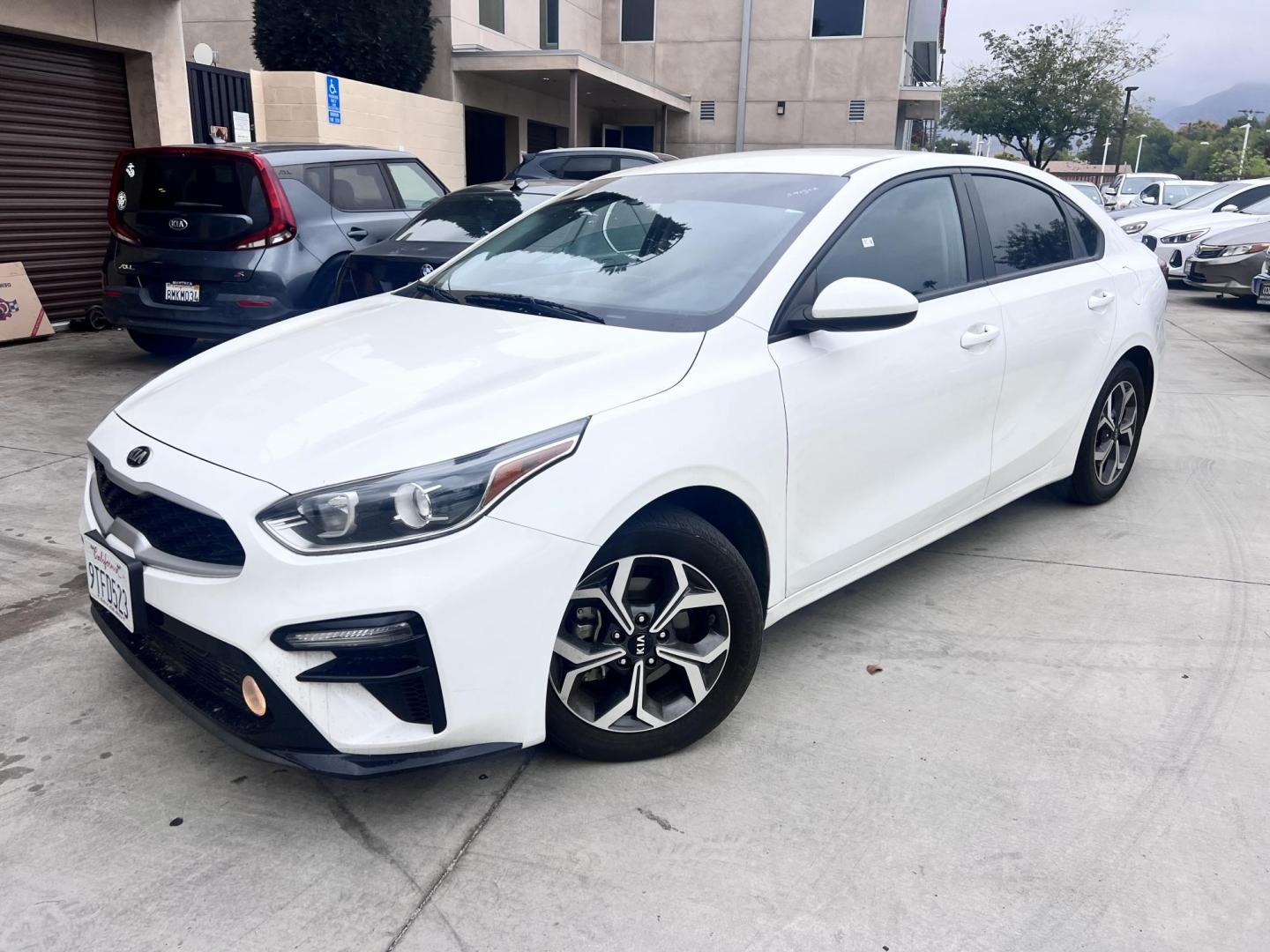 2021 White /black Kia Forte FE (3KPF24AD3ME) with an 2.0L L4 DOHC 16V engine, CVT transmission, located at 30 S. Berkeley Avenue, Pasadena, CA, 91107, (626) 248-7567, 34.145447, -118.109398 - Crown City Motors is a used “Buy Here Pay Here” car dealer in Pasadena CA. “Buy Here Pay Here” financing, means that when you purchase your vehicle from our dealership, that you make the payments to the dealership as well. We do not need the banks approval to get you approved for a used auto - Photo#0