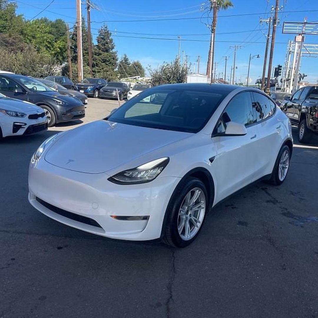2021 WHITE Tesla Model Y (5YJYGDEEXMF) with an Dual AC Electric Motors engine, Single-Speed Fixed Gear transmission, located at 412 Auto Vista Drive, Palmdale, 93551, (661) 945-0620, 34.592636, -118.136681 - Photo#0