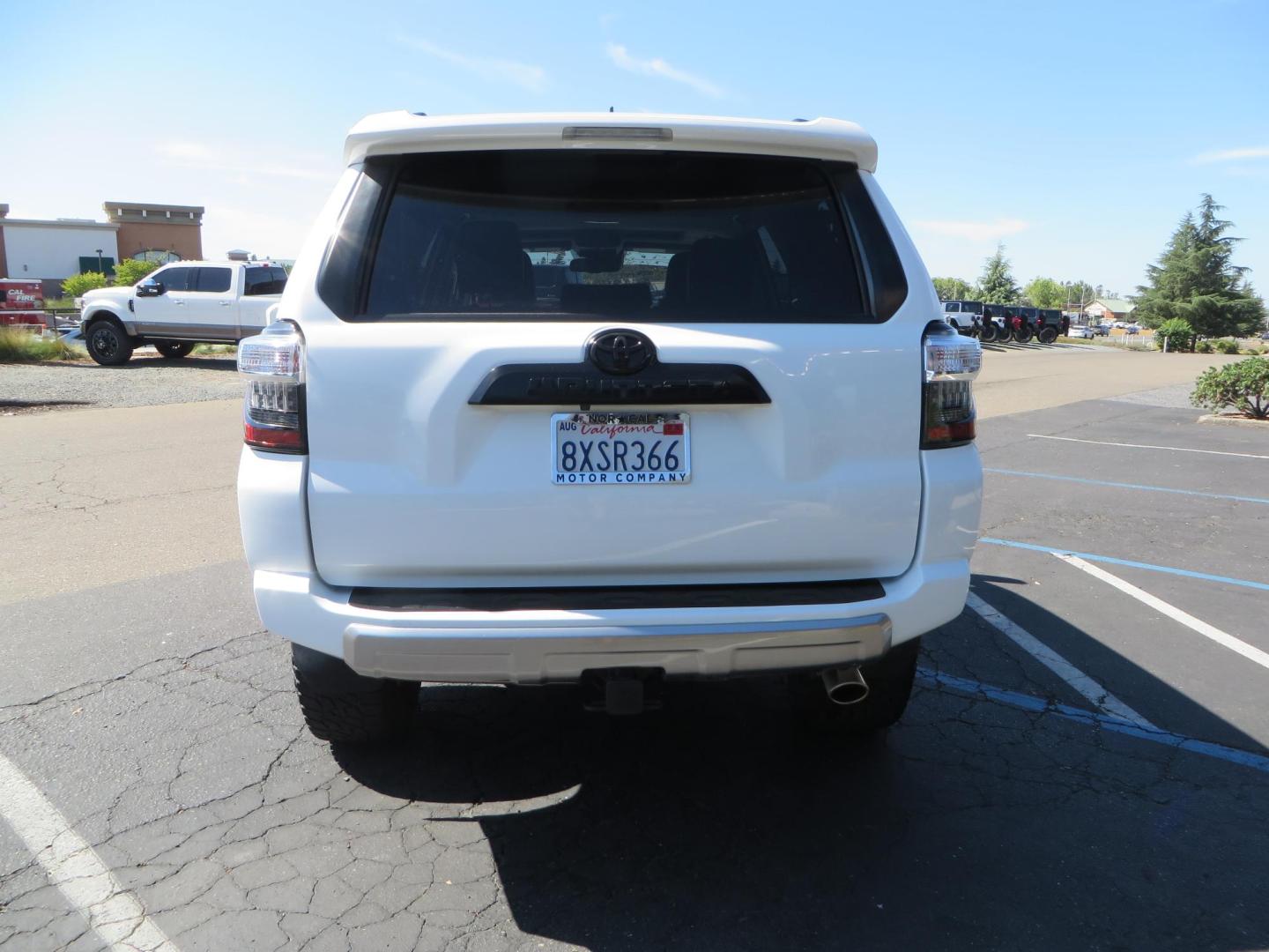 2021 White Toyota 4Runner TRD Off-road Premium 4WD (JTERU5JR5M5) with an 4.0L V6 DOHC 24V engine, 5A transmission, located at 2630 Grass Valley Highway, Auburn, CA, 95603, (530) 508-5100, 38.937893, -121.095482 - TRD Offroad Premium 4Runner ready for all of your adventures. Features Ironman suspension, 285 Falken Wildpeak AT3W tires, 17" Method Race wheels, Front winch bumper, Badlands winch, Led bumper and ditch lights, and rear cargo molle panels. - Photo#3