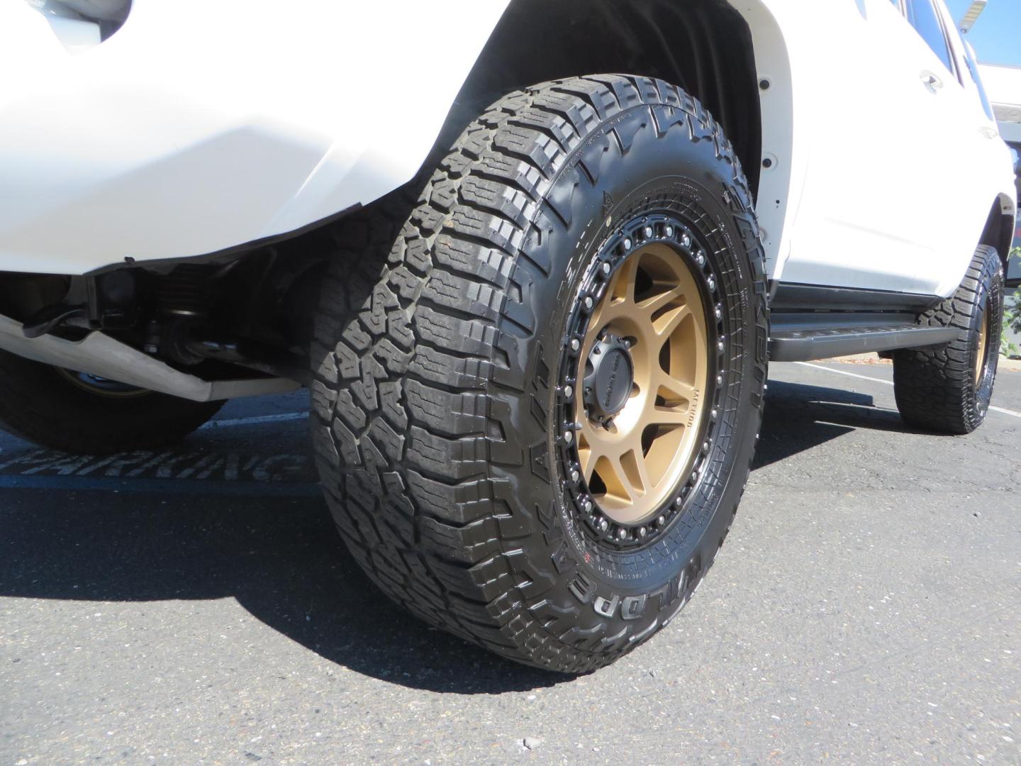 2021 White Toyota 4Runner TRD Off-road Premium 4WD (JTERU5JR5M5) with an 4.0L V6 DOHC 24V engine, 5A transmission, located at 2630 Grass Valley Highway, Auburn, CA, 95603, (530) 508-5100, 38.937893, -121.095482 - TRD Offroad Premium 4Runner ready for all of your adventures. Features Ironman suspension, 285 Falken Wildpeak AT3W tires, 17" Method Race wheels, Front winch bumper, Badlands winch, Led bumper and ditch lights, and rear cargo molle panels. - Photo#9