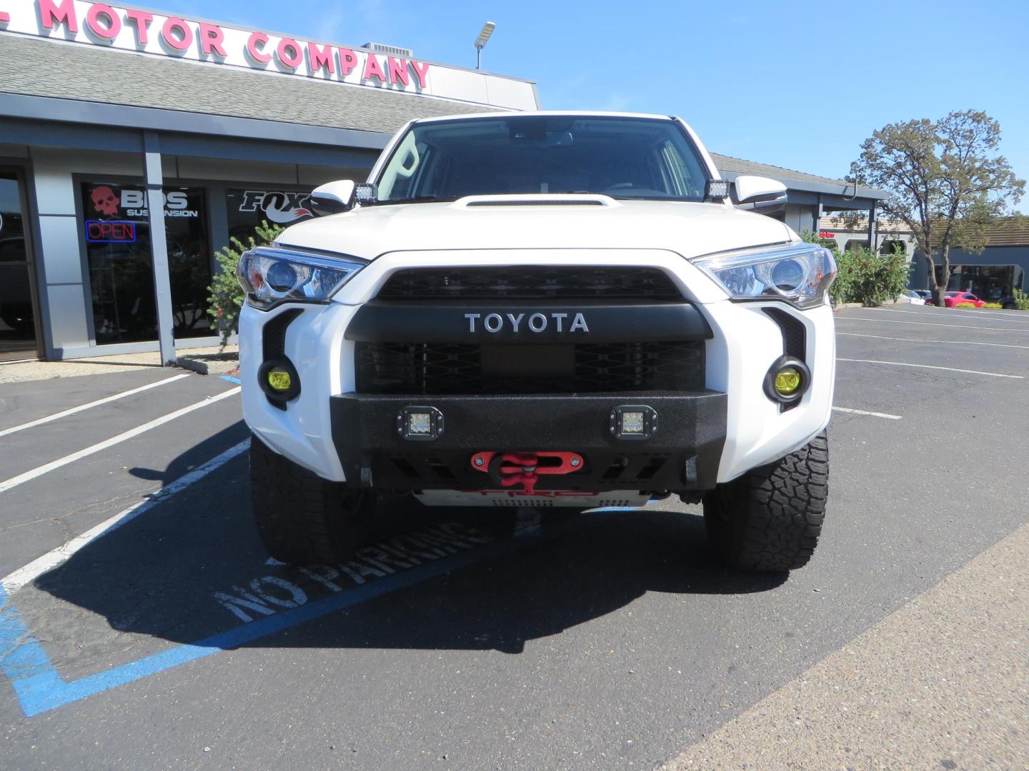 2021 White Toyota 4Runner TRD Off-road Premium 4WD (JTERU5JR5M5) with an 4.0L V6 DOHC 24V engine, 5A transmission, located at 2630 Grass Valley Highway, Auburn, CA, 95603, (530) 508-5100, 38.937893, -121.095482 - TRD Offroad Premium 4Runner ready for all of your adventures. Features Ironman suspension, 285 Falken Wildpeak AT3W tires, 17" Method Race wheels, Front winch bumper, Badlands winch, Led bumper and ditch lights, and rear cargo molle panels. - Photo#7