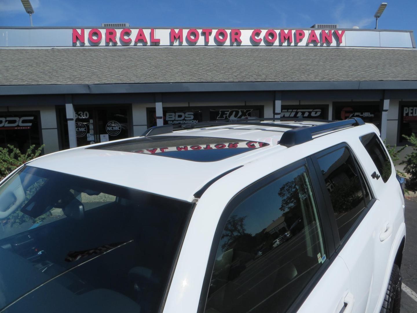 2021 White Toyota 4Runner TRD Off-road Premium 4WD (JTERU5JR5M5) with an 4.0L V6 DOHC 24V engine, 5A transmission, located at 2630 Grass Valley Highway, Auburn, CA, 95603, (530) 508-5100, 38.937893, -121.095482 - TRD Offroad Premium 4Runner ready for all of your adventures. Features Ironman suspension, 285 Falken Wildpeak AT3W tires, 17" Method Race wheels, Front winch bumper, Badlands winch, Led bumper and ditch lights, and rear cargo molle panels. - Photo#12