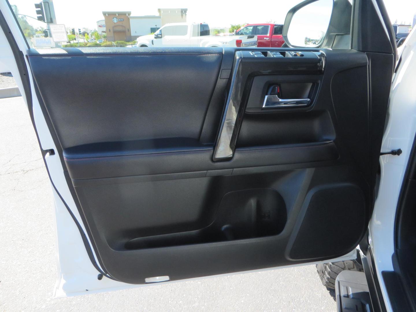 2021 White Toyota 4Runner TRD Off-road Premium 4WD (JTERU5JR5M5) with an 4.0L V6 DOHC 24V engine, 5A transmission, located at 2630 Grass Valley Highway, Auburn, CA, 95603, (530) 508-5100, 38.937893, -121.095482 - TRD Offroad Premium 4Runner ready for all of your adventures. Features Ironman suspension, 285 Falken Wildpeak AT3W tires, 17" Method Race wheels, Front winch bumper, Badlands winch, Led bumper and ditch lights, and rear cargo molle panels. - Photo#17