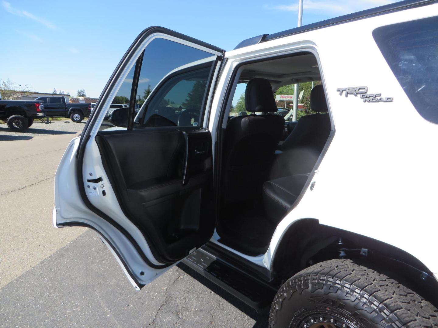 2021 White Toyota 4Runner TRD Off-road Premium 4WD (JTERU5JR5M5) with an 4.0L V6 DOHC 24V engine, 5A transmission, located at 2630 Grass Valley Highway, Auburn, CA, 95603, (530) 508-5100, 38.937893, -121.095482 - TRD Offroad Premium 4Runner ready for all of your adventures. Features Ironman suspension, 285 Falken Wildpeak AT3W tires, 17" Method Race wheels, Front winch bumper, Badlands winch, Led bumper and ditch lights, and rear cargo molle panels. - Photo#40