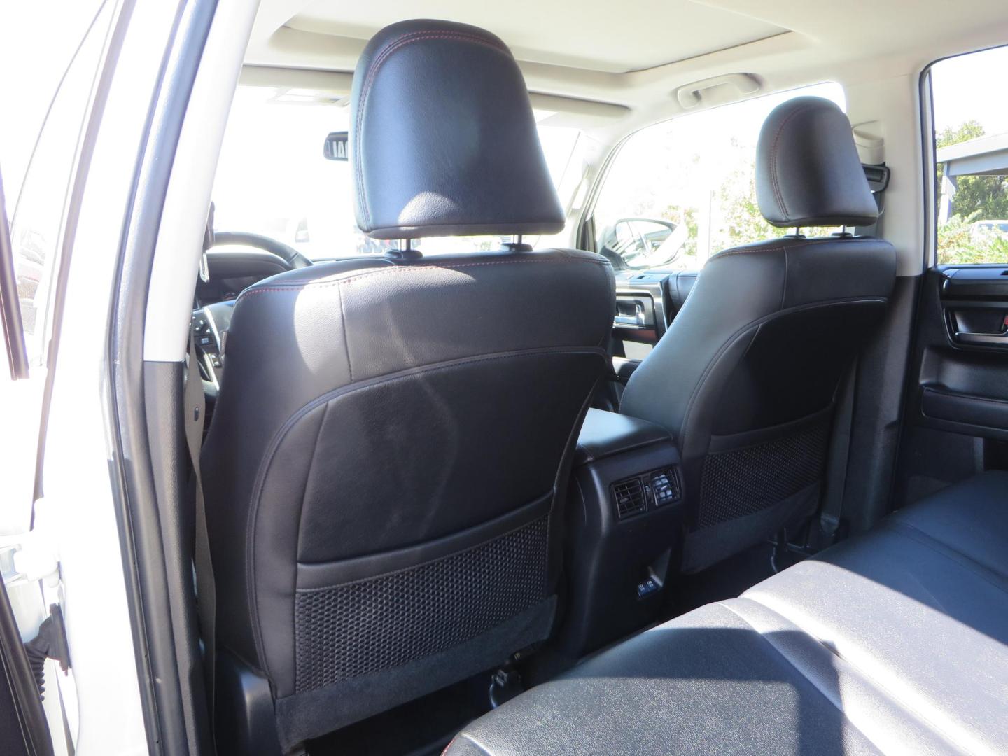 2021 White Toyota 4Runner TRD Off-road Premium 4WD (JTERU5JR5M5) with an 4.0L V6 DOHC 24V engine, 5A transmission, located at 2630 Grass Valley Highway, Auburn, CA, 95603, (530) 508-5100, 38.937893, -121.095482 - TRD Offroad Premium 4Runner ready for all of your adventures. Features Ironman suspension, 285 Falken Wildpeak AT3W tires, 17" Method Race wheels, Front winch bumper, Badlands winch, Led bumper and ditch lights, and rear cargo molle panels. - Photo#46