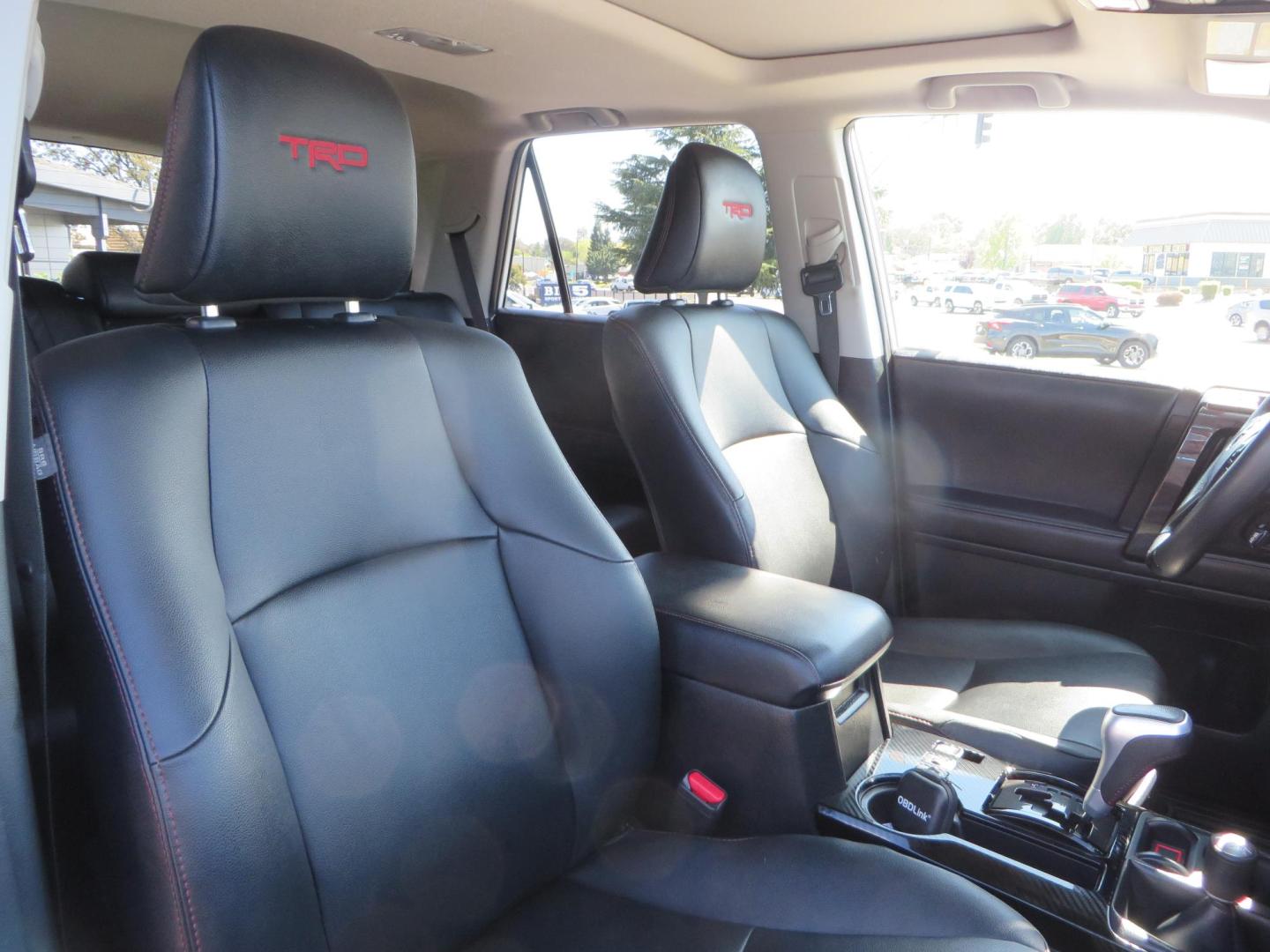 2021 White Toyota 4Runner TRD Off-road Premium 4WD (JTERU5JR5M5) with an 4.0L V6 DOHC 24V engine, 5A transmission, located at 2630 Grass Valley Highway, Auburn, CA, 95603, (530) 508-5100, 38.937893, -121.095482 - TRD Offroad Premium 4Runner ready for all of your adventures. Features Ironman suspension, 285 Falken Wildpeak AT3W tires, 17" Method Race wheels, Front winch bumper, Badlands winch, Led bumper and ditch lights, and rear cargo molle panels. - Photo#52