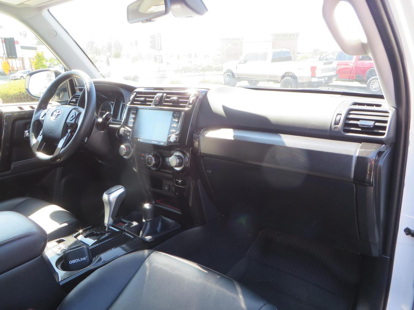 2021 White Toyota 4Runner TRD Off-road Premium 4WD (JTERU5JR5M5) with an 4.0L V6 DOHC 24V engine, 5A transmission, located at 2630 Grass Valley Highway, Auburn, CA, 95603, (530) 508-5100, 38.937893, -121.095482 - TRD Offroad Premium 4Runner ready for all of your adventures. Features Ironman suspension, 285 Falken Wildpeak AT3W tires, 17" Method Race wheels, Front winch bumper, Badlands winch, Led bumper and ditch lights, and rear cargo molle panels. - Photo#54