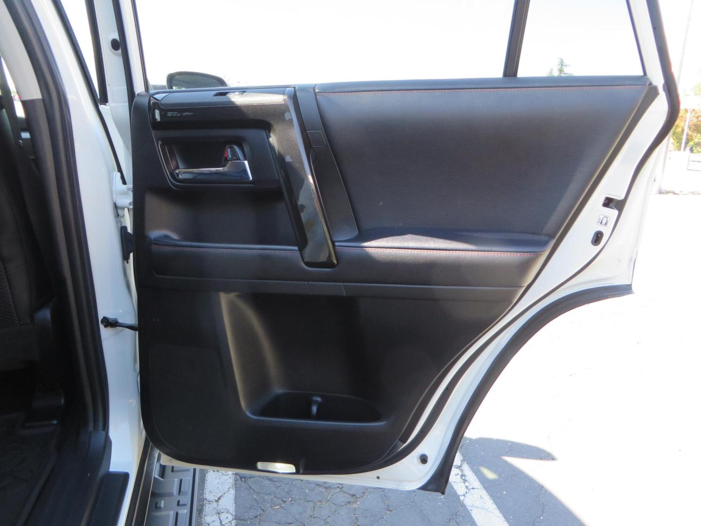 2021 White Toyota 4Runner TRD Off-road Premium 4WD (JTERU5JR5M5) with an 4.0L V6 DOHC 24V engine, 5A transmission, located at 2630 Grass Valley Highway, Auburn, CA, 95603, (530) 508-5100, 38.937893, -121.095482 - TRD Offroad Premium 4Runner ready for all of your adventures. Features Ironman suspension, 285 Falken Wildpeak AT3W tires, 17" Method Race wheels, Front winch bumper, Badlands winch, Led bumper and ditch lights, and rear cargo molle panels. - Photo#56