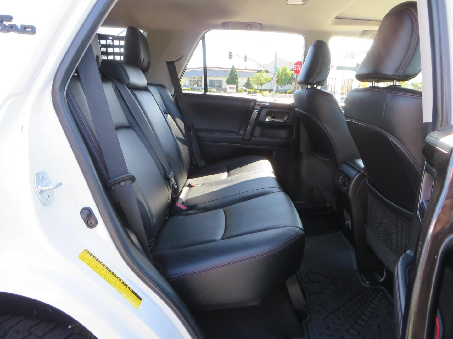 2021 White Toyota 4Runner TRD Off-road Premium 4WD (JTERU5JR5M5) with an 4.0L V6 DOHC 24V engine, 5A transmission, located at 2630 Grass Valley Highway, Auburn, CA, 95603, (530) 508-5100, 38.937893, -121.095482 - TRD Offroad Premium 4Runner ready for all of your adventures. Features Ironman suspension, 285 Falken Wildpeak AT3W tires, 17" Method Race wheels, Front winch bumper, Badlands winch, Led bumper and ditch lights, and rear cargo molle panels. - Photo#58