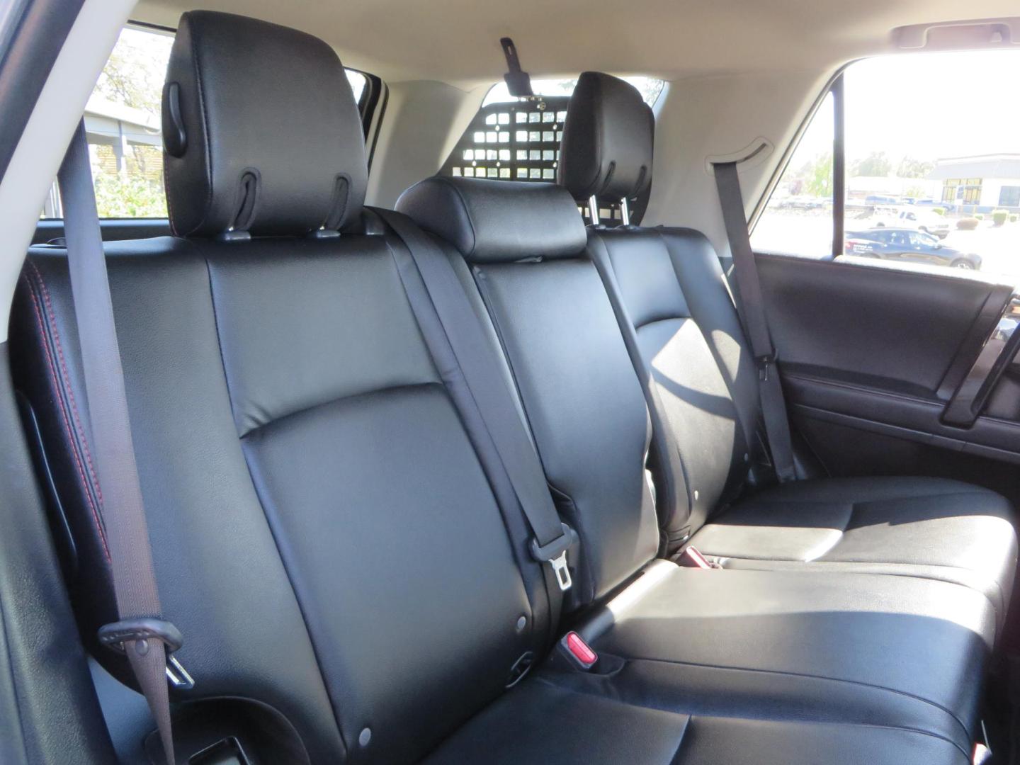 2021 White Toyota 4Runner TRD Off-road Premium 4WD (JTERU5JR5M5) with an 4.0L V6 DOHC 24V engine, 5A transmission, located at 2630 Grass Valley Highway, Auburn, CA, 95603, (530) 508-5100, 38.937893, -121.095482 - TRD Offroad Premium 4Runner ready for all of your adventures. Features Ironman suspension, 285 Falken Wildpeak AT3W tires, 17" Method Race wheels, Front winch bumper, Badlands winch, Led bumper and ditch lights, and rear cargo molle panels. - Photo#59