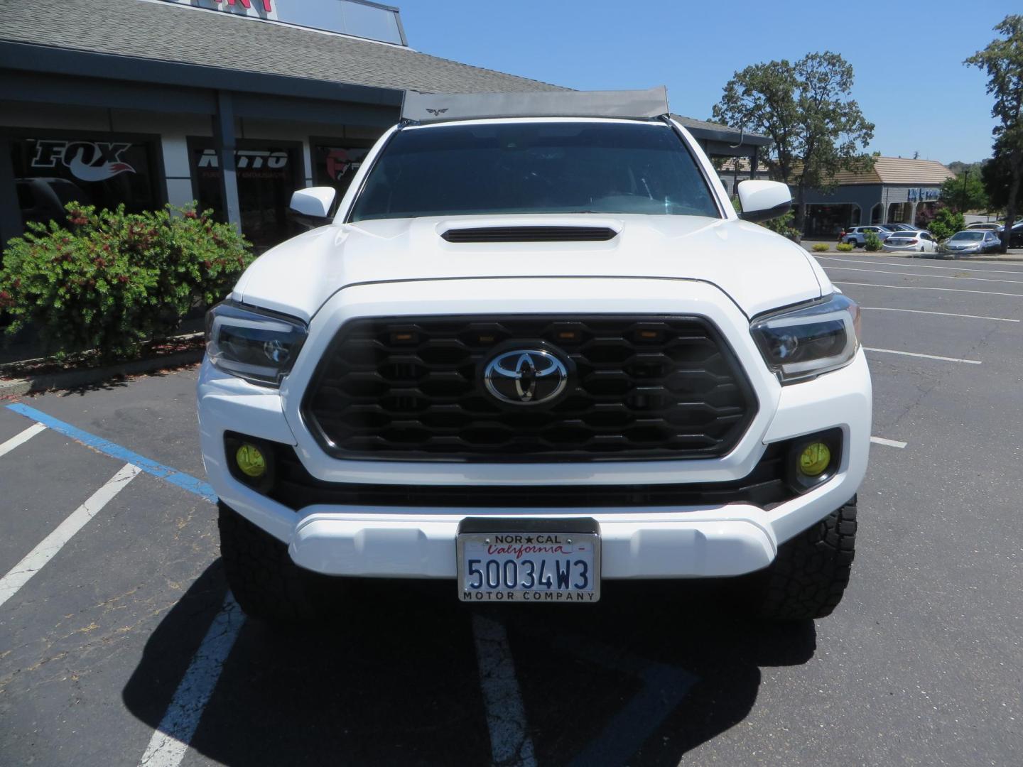 2021 White Toyota Tacoma SR5 Double Cab V6 6AT 4WD (3TMCZ5AN1MM) with an 3.5L V6 DOHC 24V engine, 6A transmission, located at 2630 Grass Valley Highway, Auburn, CA, 95603, (530) 508-5100, 38.937893, -121.095482 - Icon Vehicle Dynamics remote reservoir coilovers and shocks, Icon Upper control arms, 1552 wheels, Toyo AT3 tires, Rock Sliders, Victory 4x4 roof and camper shell rack, Leer Camper shell, Banks Idash. - Photo#2
