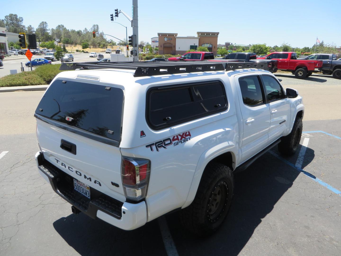 2021 White Toyota Tacoma SR5 Double Cab V6 6AT 4WD (3TMCZ5AN1MM) with an 3.5L V6 DOHC 24V engine, 6A transmission, located at 2630 Grass Valley Highway, Auburn, CA, 95603, (530) 508-5100, 38.937893, -121.095482 - Icon Vehicle Dynamics remote reservoir coilovers and shocks, Icon Upper control arms, 1552 wheels, Toyo AT3 tires, Rock Sliders, Victory 4x4 roof and camper shell rack, Leer Camper shell, Banks Idash. - Photo#8