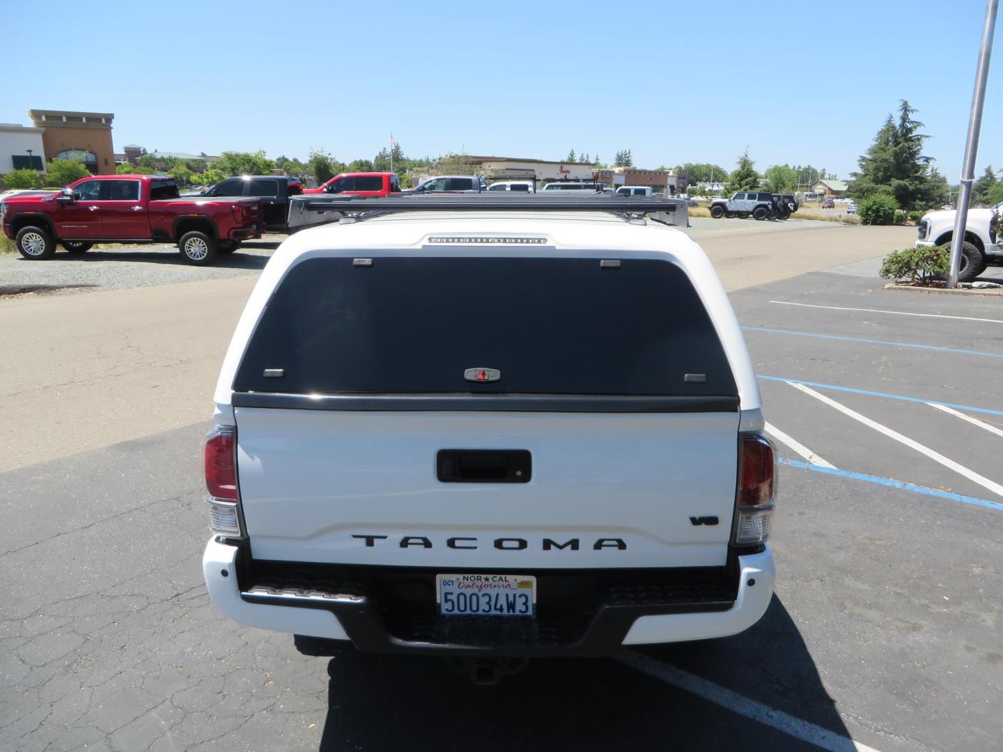 2021 White Toyota Tacoma SR5 Double Cab V6 6AT 4WD (3TMCZ5AN1MM) with an 3.5L V6 DOHC 24V engine, 6A transmission, located at 2630 Grass Valley Highway, Auburn, CA, 95603, (530) 508-5100, 38.937893, -121.095482 - Icon Vehicle Dynamics remote reservoir coilovers and shocks, Icon Upper control arms, 1552 wheels, Toyo AT3 tires, Rock Sliders, Victory 4x4 roof and camper shell rack, Leer Camper shell, Banks Idash. - Photo#10
