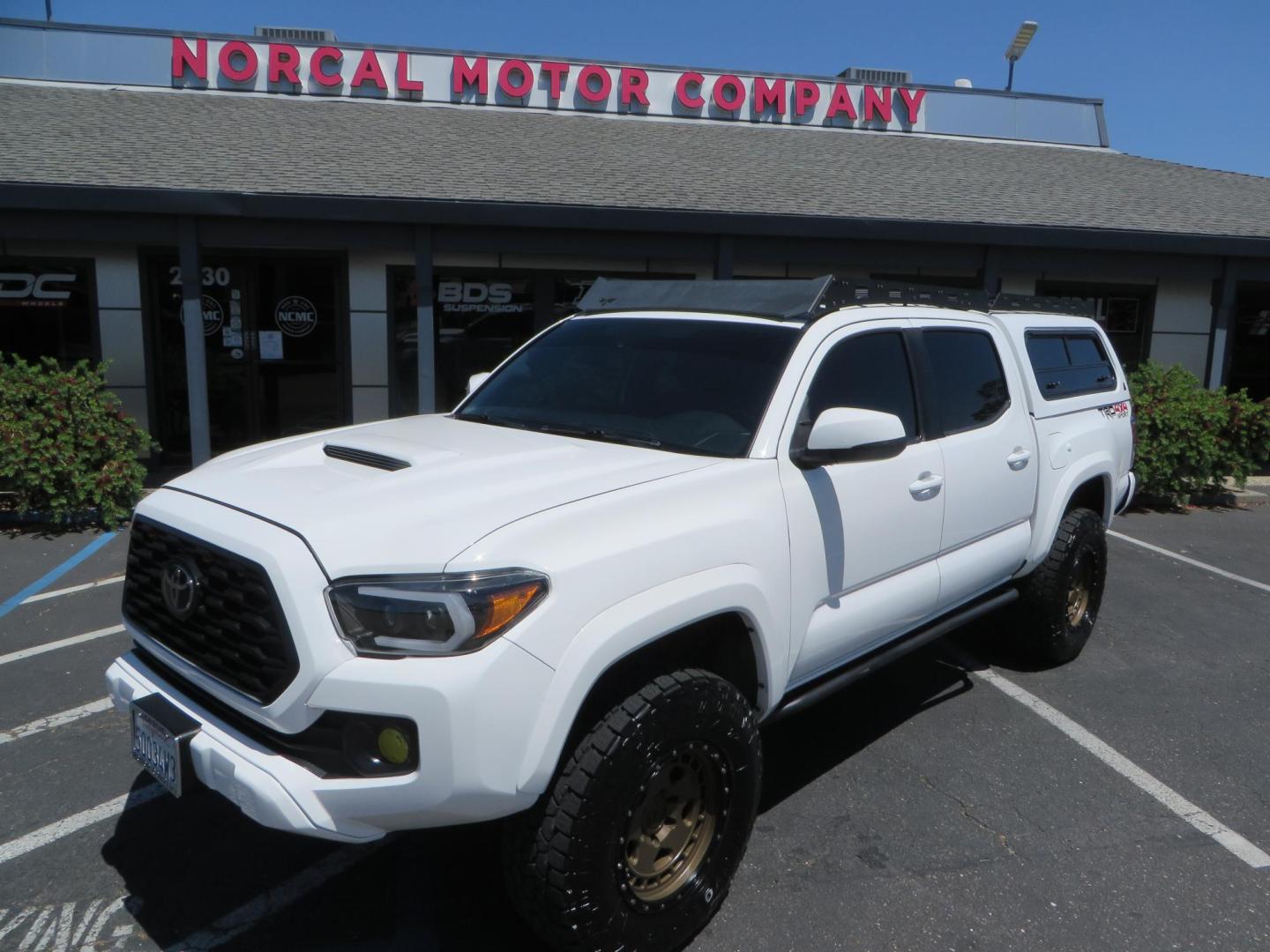 2021 White Toyota Tacoma SR5 Double Cab V6 6AT 4WD (3TMCZ5AN1MM) with an 3.5L V6 DOHC 24V engine, 6A transmission, located at 2630 Grass Valley Highway, Auburn, CA, 95603, (530) 508-5100, 38.937893, -121.095482 - Icon Vehicle Dynamics remote reservoir coilovers and shocks, Icon Upper control arms, 1552 wheels, Toyo AT3 tires, Rock Sliders, Victory 4x4 roof and camper shell rack, Leer Camper shell, Banks Idash. - Photo#15