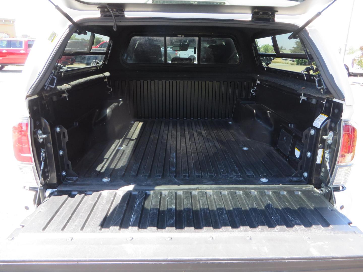 2021 White Toyota Tacoma SR5 Double Cab V6 6AT 4WD (3TMCZ5AN1MM) with an 3.5L V6 DOHC 24V engine, 6A transmission, located at 2630 Grass Valley Highway, Auburn, CA, 95603, (530) 508-5100, 38.937893, -121.095482 - Icon Vehicle Dynamics remote reservoir coilovers and shocks, Icon Upper control arms, 1552 wheels, Toyo AT3 tires, Rock Sliders, Victory 4x4 roof and camper shell rack, Leer Camper shell, Banks Idash. - Photo#35