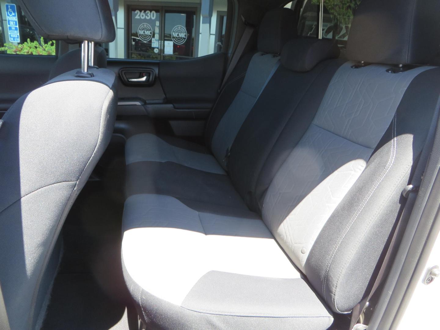 2021 White Toyota Tacoma SR5 Double Cab V6 6AT 4WD (3TMCZ5AN1MM) with an 3.5L V6 DOHC 24V engine, 6A transmission, located at 2630 Grass Valley Highway, Auburn, CA, 95603, (530) 508-5100, 38.937893, -121.095482 - Icon Vehicle Dynamics remote reservoir coilovers and shocks, Icon Upper control arms, 1552 wheels, Toyo AT3 tires, Rock Sliders, Victory 4x4 roof and camper shell rack, Leer Camper shell, Banks Idash. - Photo#50