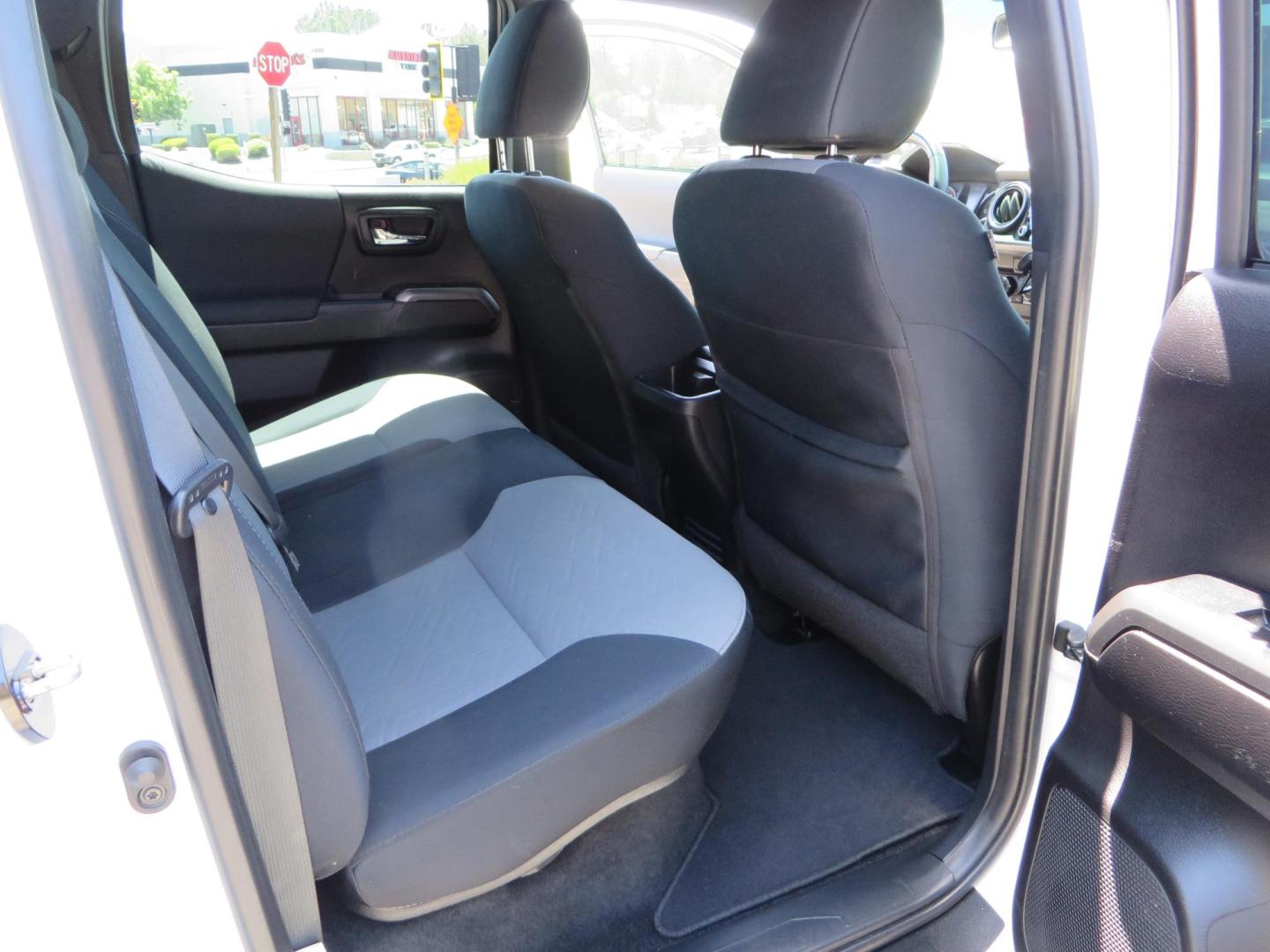 2021 White Toyota Tacoma SR5 Double Cab V6 6AT 4WD (3TMCZ5AN1MM) with an 3.5L V6 DOHC 24V engine, 6A transmission, located at 2630 Grass Valley Highway, Auburn, CA, 95603, (530) 508-5100, 38.937893, -121.095482 - Icon Vehicle Dynamics remote reservoir coilovers and shocks, Icon Upper control arms, 1552 wheels, Toyo AT3 tires, Rock Sliders, Victory 4x4 roof and camper shell rack, Leer Camper shell, Banks Idash. - Photo#52