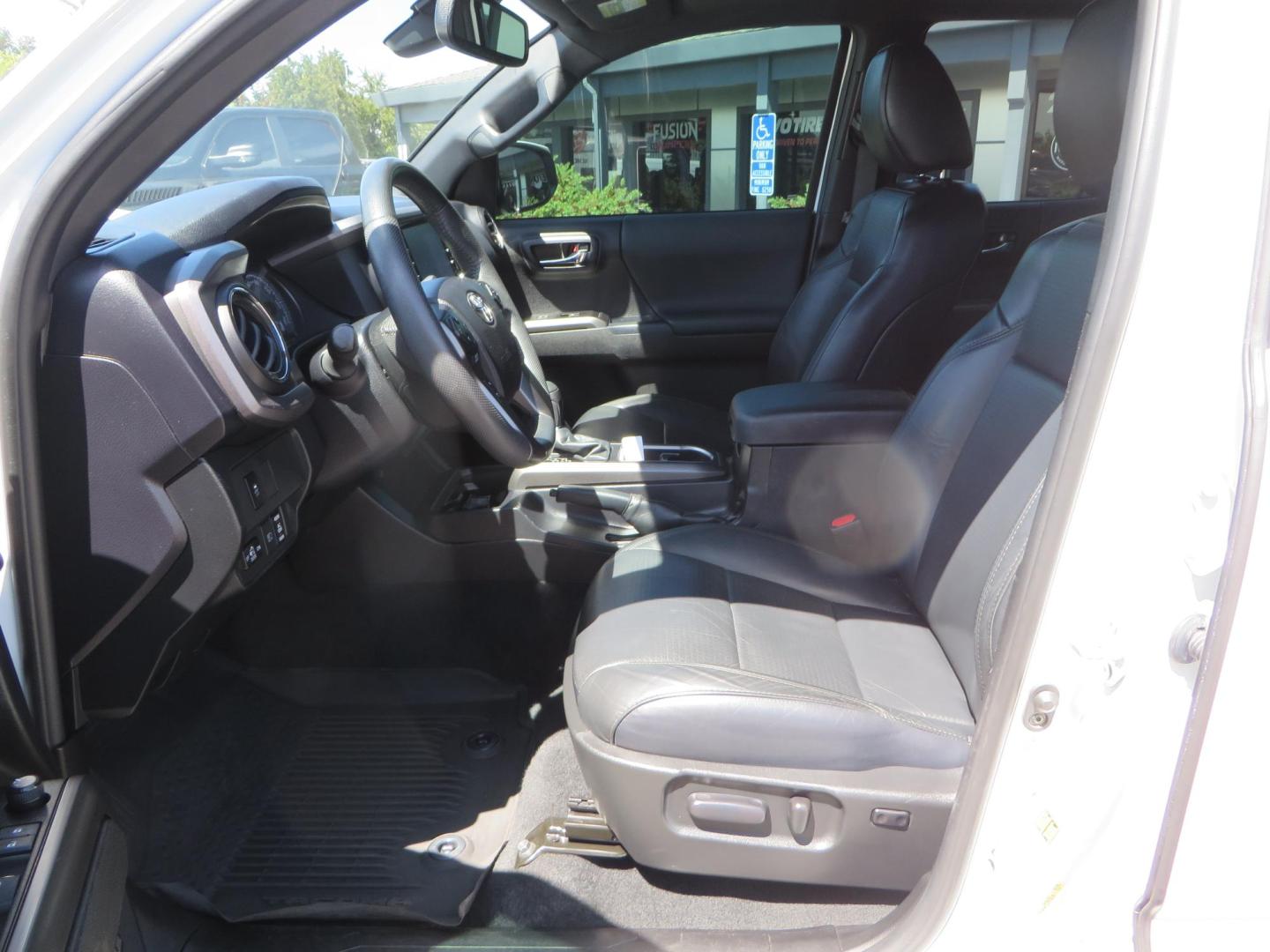 2021 White Toyota Tacoma SR5 Double Cab V6 6AT 4WD (3TYCZ5AN8MT) with an 3.5L V6 DOHC 24V engine, 6A transmission, located at 2630 Grass Valley Highway, Auburn, CA, 95603, (530) 508-5100, 38.937893, -121.095482 - Leveled Tacoma sitting on 18" Fuel wheels, Toyo RT tires, and window tint. - Photo#16