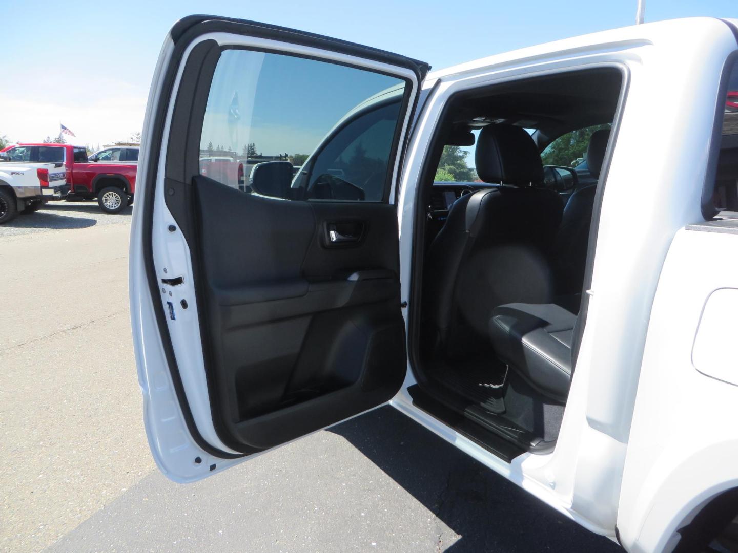 2021 White Toyota Tacoma SR5 Double Cab V6 6AT 4WD (3TYCZ5AN8MT) with an 3.5L V6 DOHC 24V engine, 6A transmission, located at 2630 Grass Valley Highway, Auburn, CA, 95603, (530) 508-5100, 38.937893, -121.095482 - Leveled Tacoma sitting on 18" Fuel wheels, Toyo RT tires, and window tint. - Photo#33