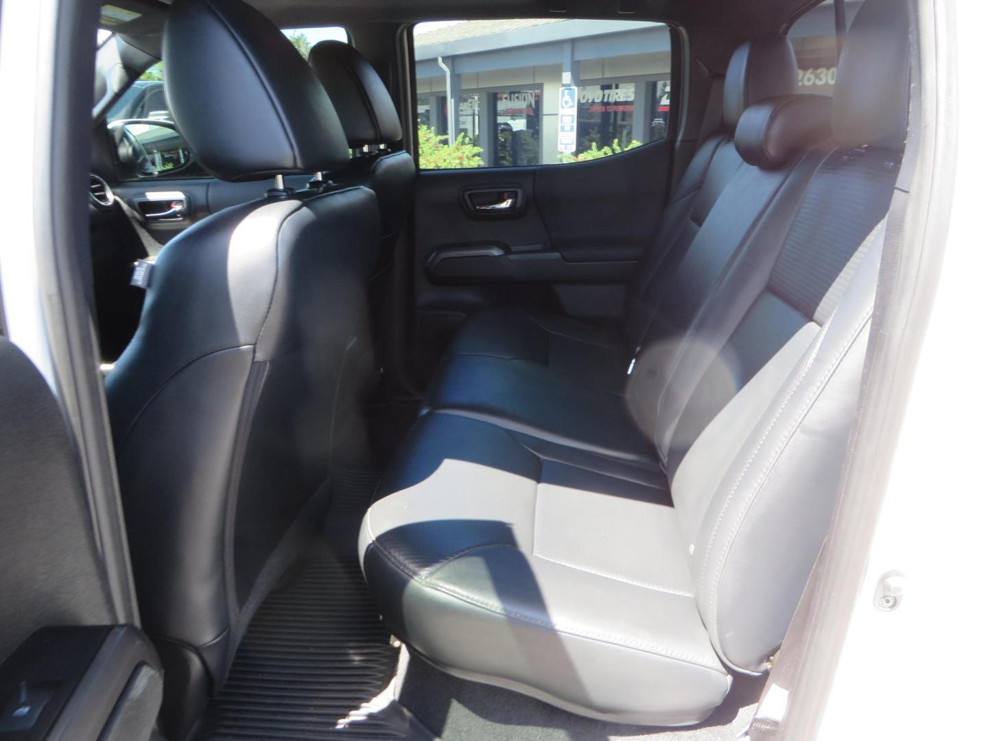 2021 White Toyota Tacoma SR5 Double Cab V6 6AT 4WD (3TYCZ5AN8MT) with an 3.5L V6 DOHC 24V engine, 6A transmission, located at 2630 Grass Valley Highway, Auburn, CA, 95603, (530) 508-5100, 38.937893, -121.095482 - Leveled Tacoma sitting on 18" Fuel wheels, Toyo RT tires, and window tint. - Photo#35