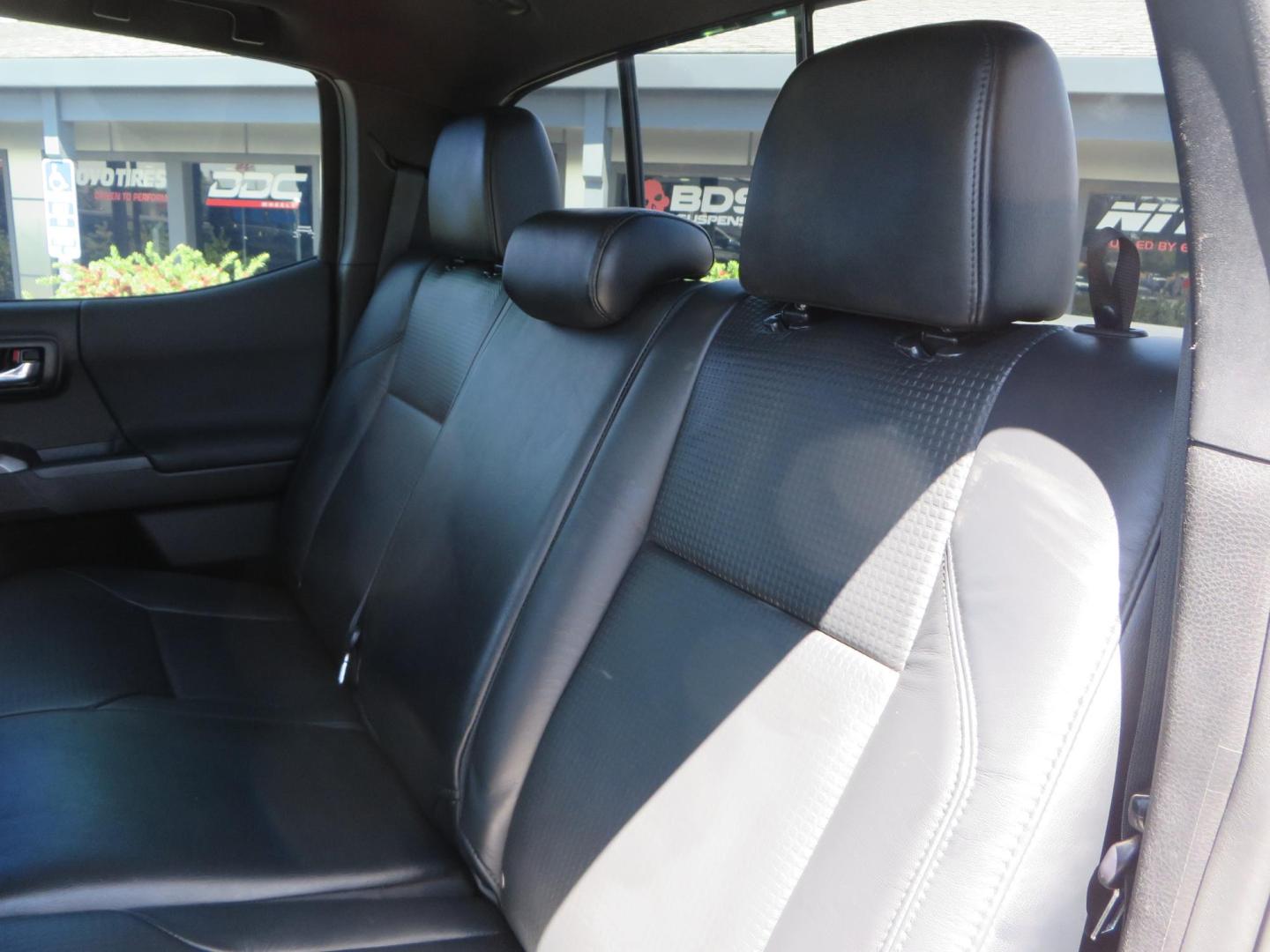 2021 White Toyota Tacoma SR5 Double Cab V6 6AT 4WD (3TYCZ5AN8MT) with an 3.5L V6 DOHC 24V engine, 6A transmission, located at 2630 Grass Valley Highway, Auburn, CA, 95603, (530) 508-5100, 38.937893, -121.095482 - Leveled Tacoma sitting on 18" Fuel wheels, Toyo RT tires, and window tint. - Photo#36