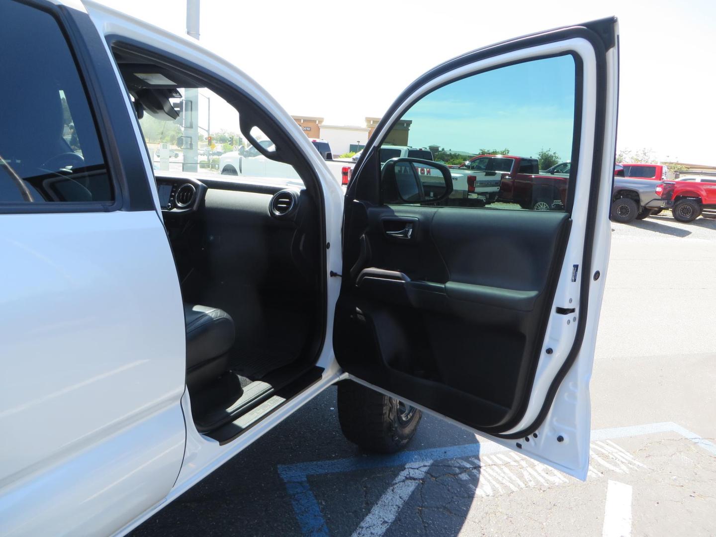 2021 White Toyota Tacoma SR5 Double Cab V6 6AT 4WD (3TYCZ5AN8MT) with an 3.5L V6 DOHC 24V engine, 6A transmission, located at 2630 Grass Valley Highway, Auburn, CA, 95603, (530) 508-5100, 38.937893, -121.095482 - Leveled Tacoma sitting on 18" Fuel wheels, Toyo RT tires, and window tint. - Photo#39