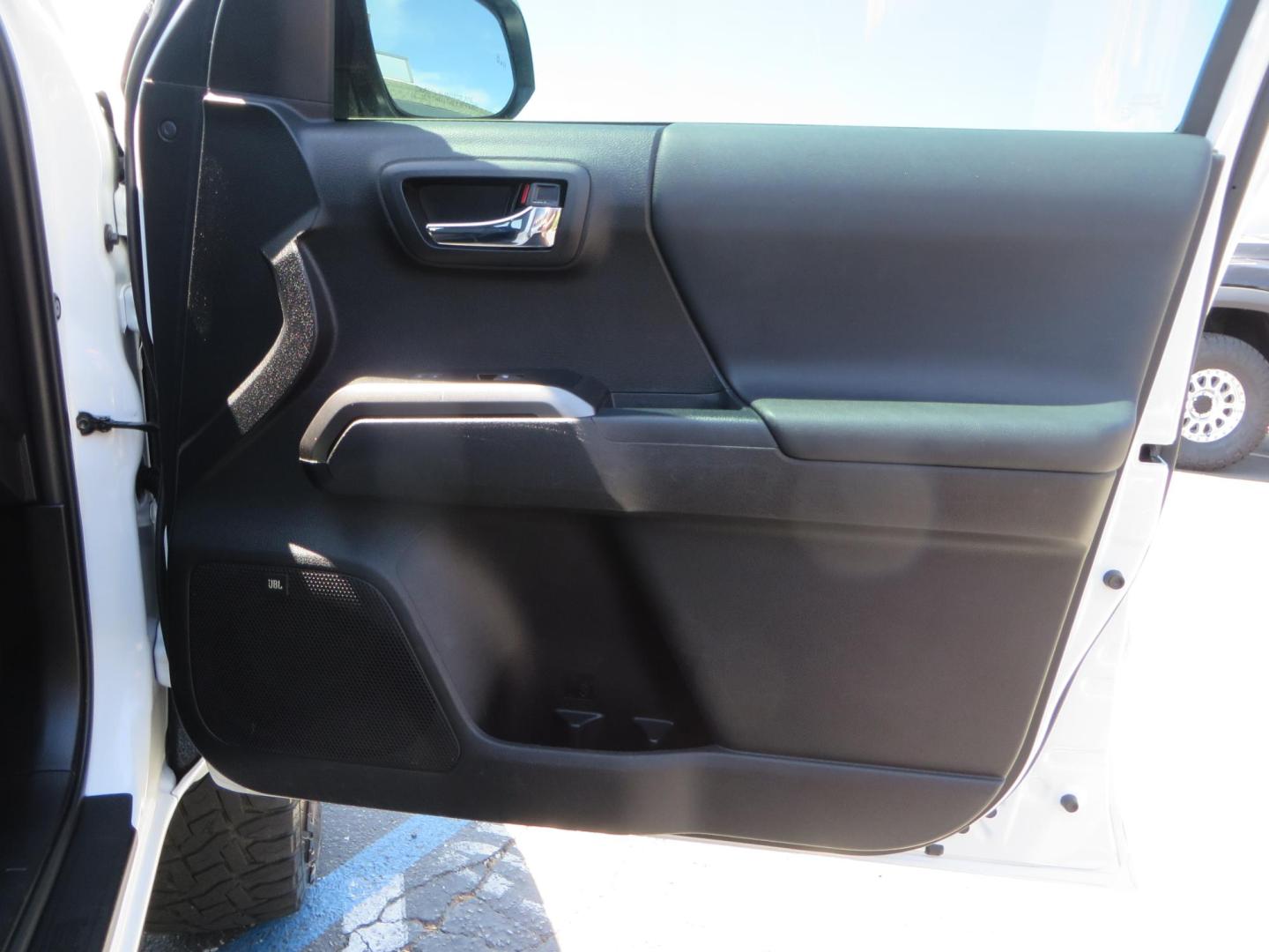 2021 White Toyota Tacoma SR5 Double Cab V6 6AT 4WD (3TYCZ5AN8MT) with an 3.5L V6 DOHC 24V engine, 6A transmission, located at 2630 Grass Valley Highway, Auburn, CA, 95603, (530) 508-5100, 38.937893, -121.095482 - Leveled Tacoma sitting on 18" Fuel wheels, Toyo RT tires, and window tint. - Photo#40