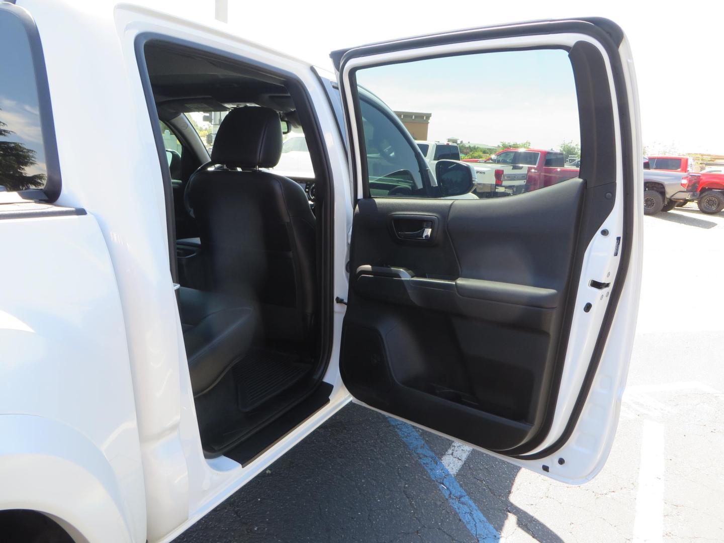 2021 White Toyota Tacoma SR5 Double Cab V6 6AT 4WD (3TYCZ5AN8MT) with an 3.5L V6 DOHC 24V engine, 6A transmission, located at 2630 Grass Valley Highway, Auburn, CA, 95603, (530) 508-5100, 38.937893, -121.095482 - Leveled Tacoma sitting on 18" Fuel wheels, Toyo RT tires, and window tint. - Photo#47