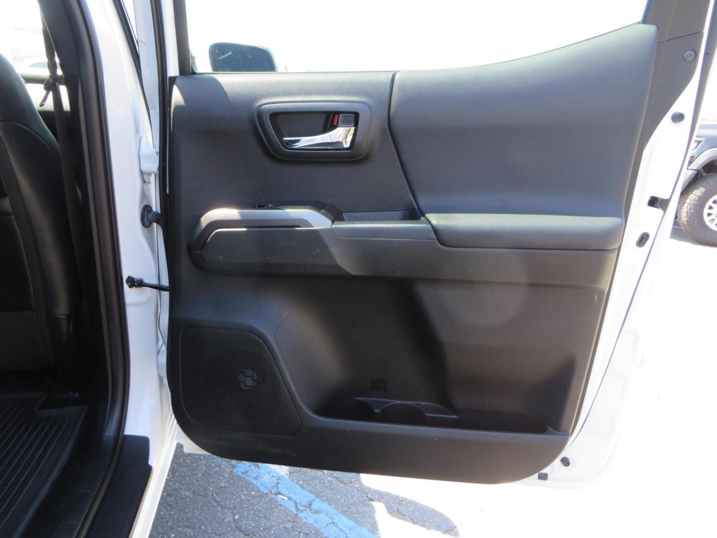 2021 White Toyota Tacoma SR5 Double Cab V6 6AT 4WD (3TYCZ5AN8MT) with an 3.5L V6 DOHC 24V engine, 6A transmission, located at 2630 Grass Valley Highway, Auburn, CA, 95603, (530) 508-5100, 38.937893, -121.095482 - Leveled Tacoma sitting on 18" Fuel wheels, Toyo RT tires, and window tint. - Photo#48